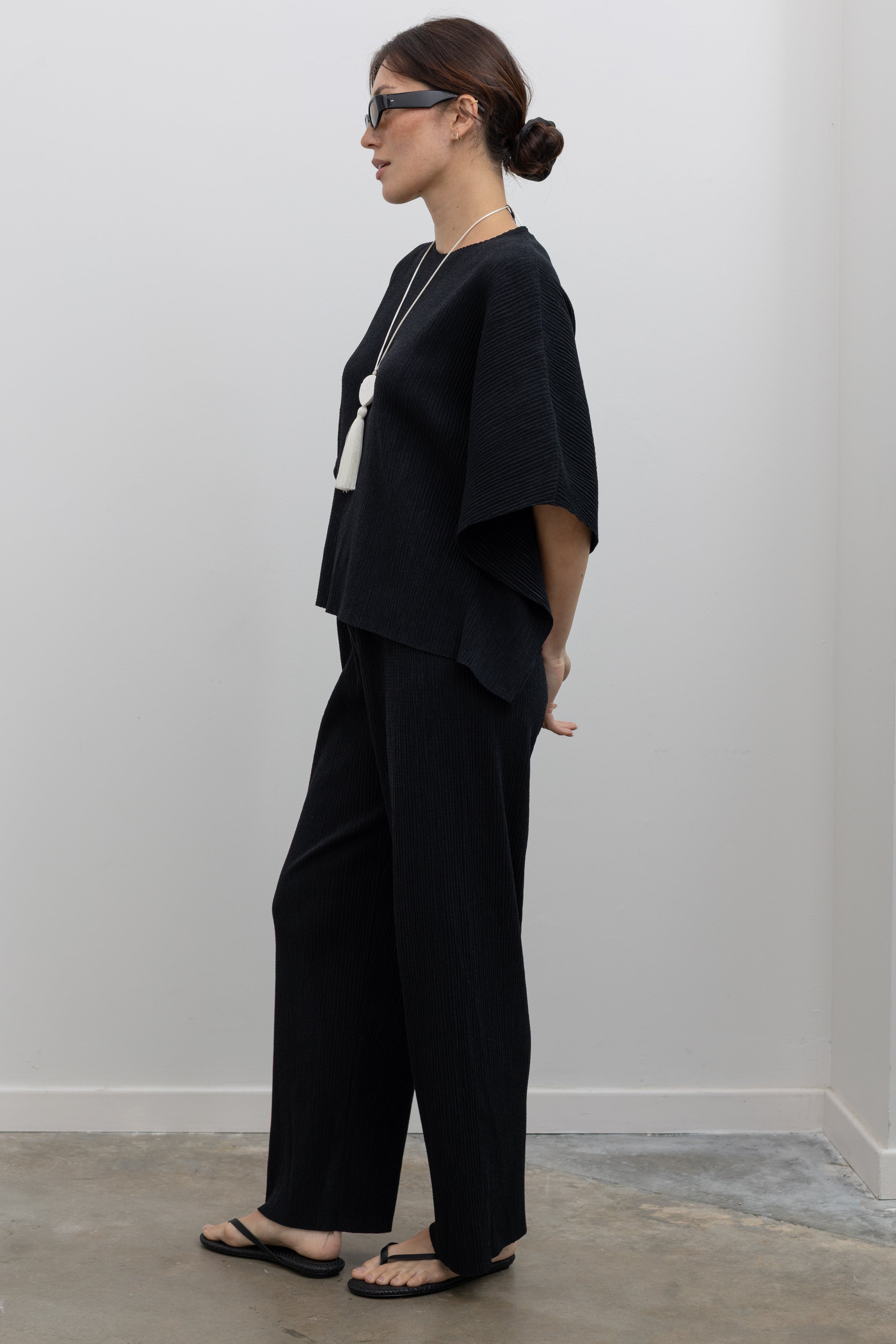 Collective relaxed plissé pleated pull-on pants with straight-leg silhouette at Alas Eius