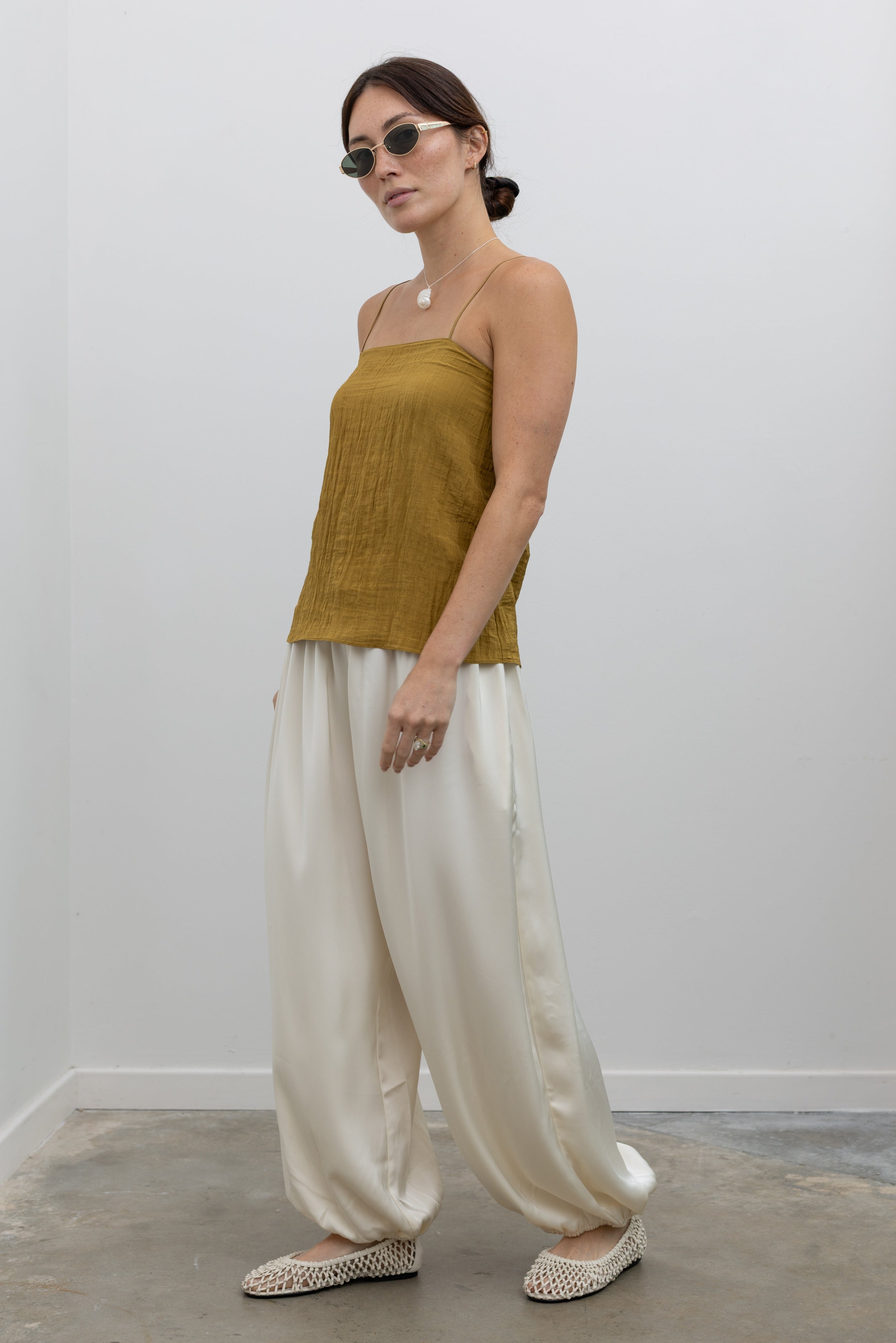 Collective soft double crepe pants featuring sculptural silhouette and elasticized hems at Alas Eius