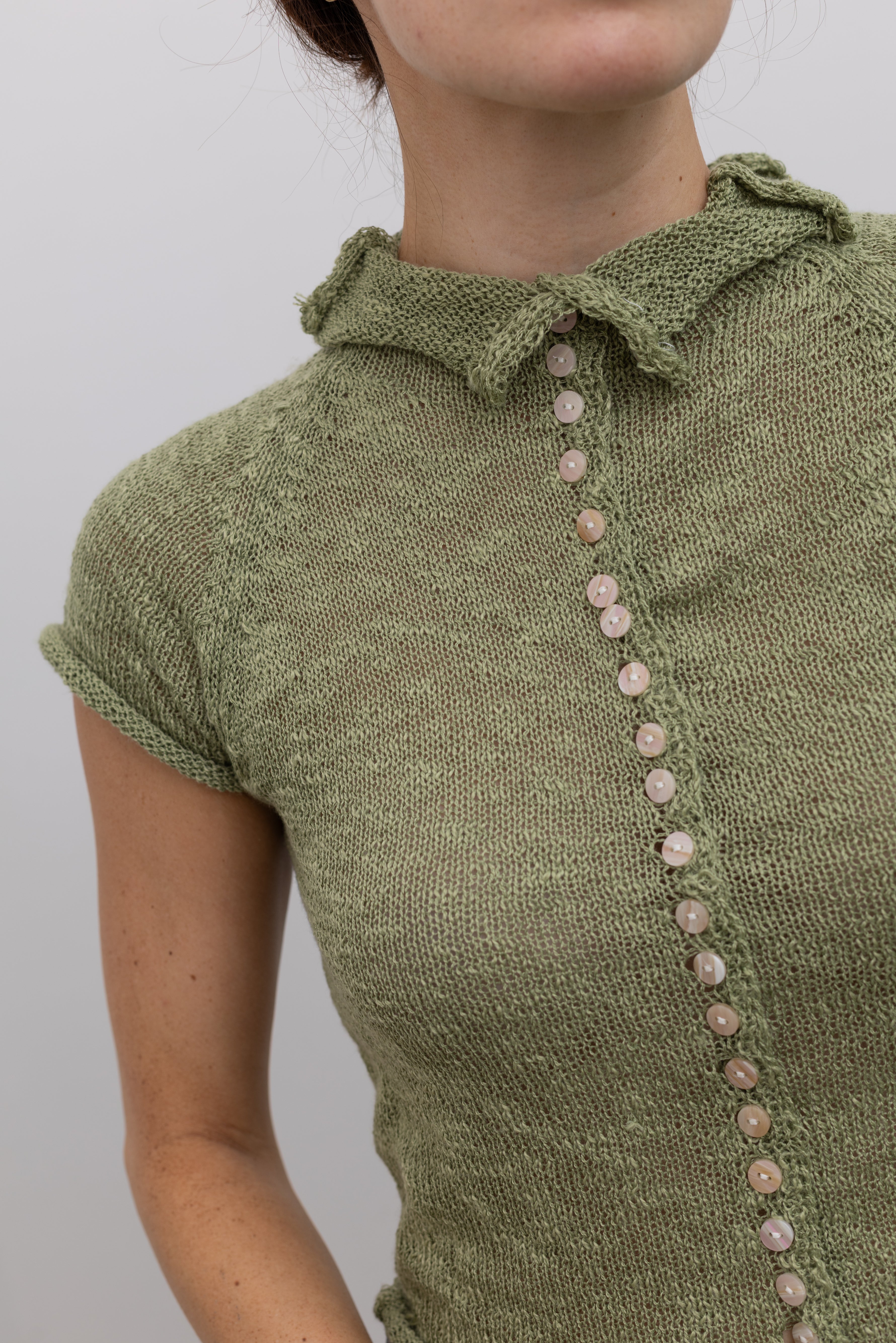 Collective slightly cropped knit mock neck top in a lightweight fabric at Alas Eius
