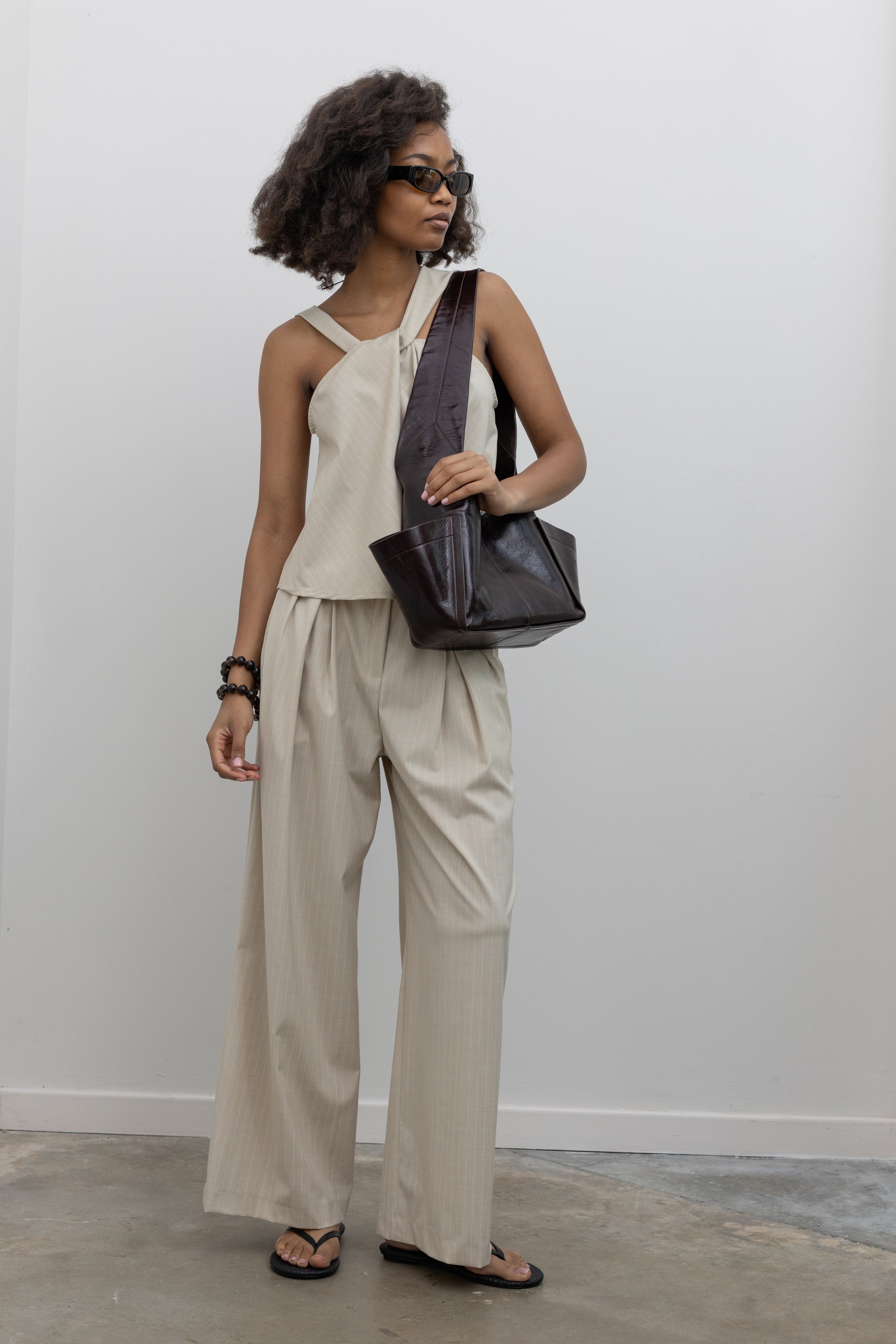 Collective voluminous pinstripe trousers with contrast waistband at Alas Eius