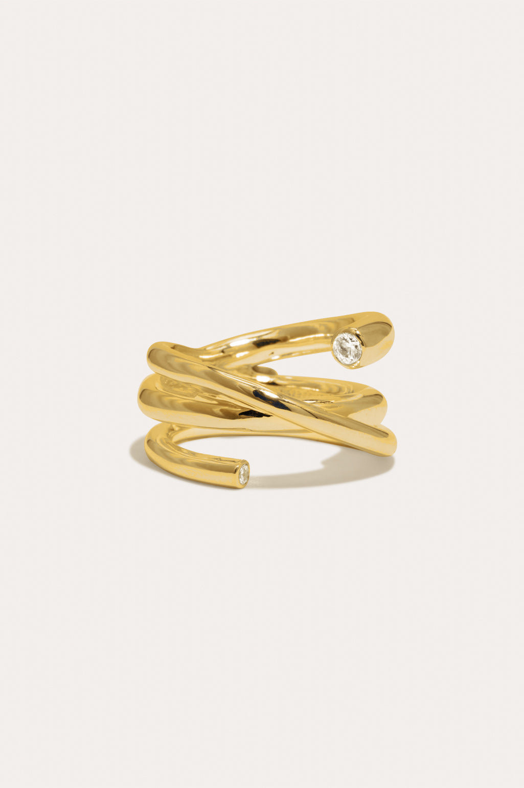 Completed Works handcrafted 18ct gold vermeil Coil ring with two white zirconia stones and a contemporary sculptural silhouette at Alas Eius