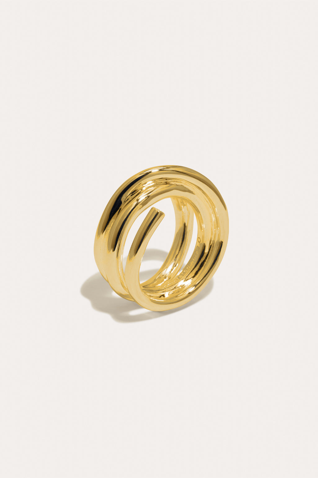 Completed Works sculptural 18ct gold vermeil wrap ring accented with two brilliant white zirconia stones at Alas Eius