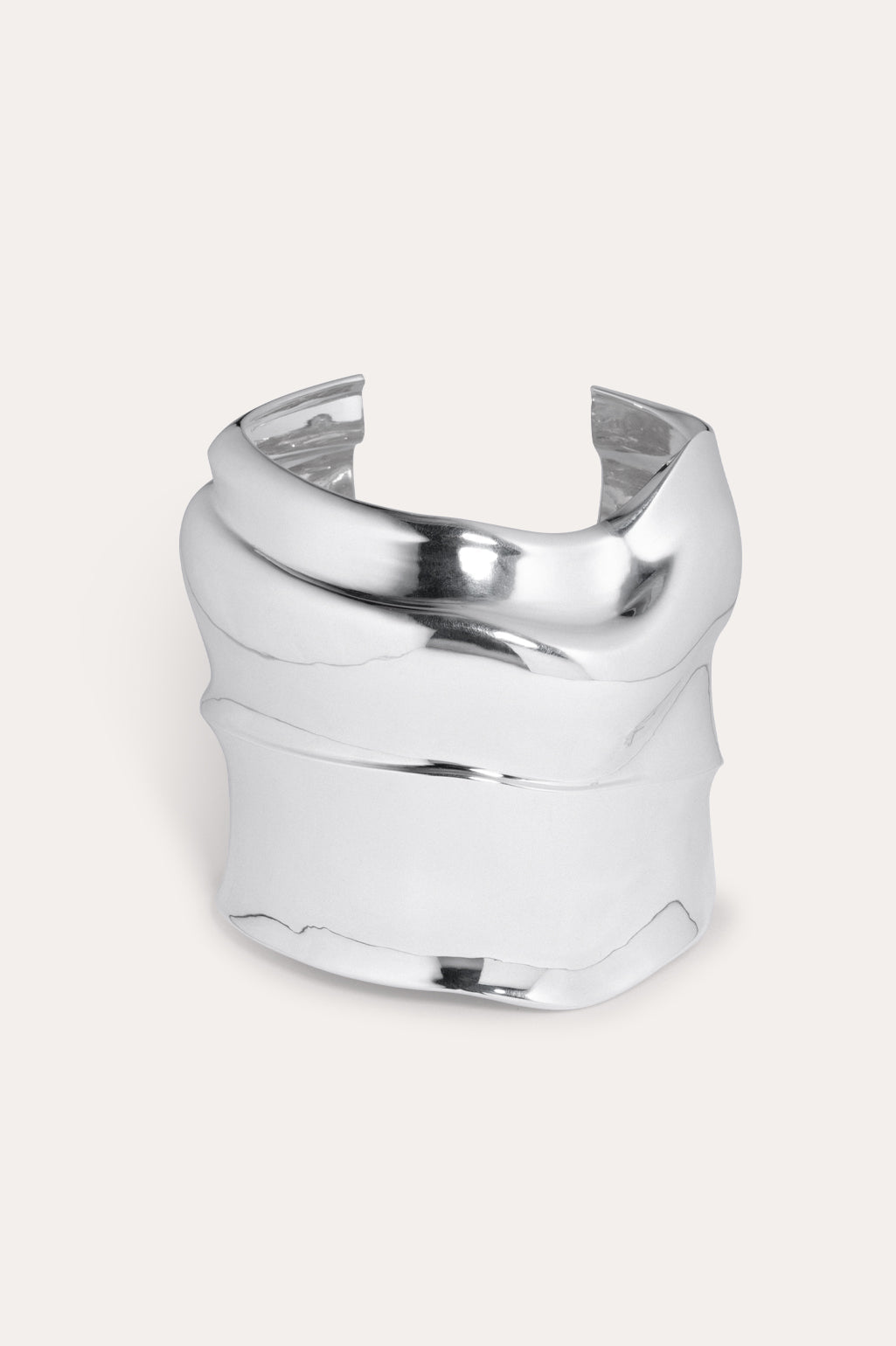 Completed Works Foreshore silver plated recycled sterling silver cuff bracelet wrapping the wrist with a bold sculptural silhouette at Alas Eius