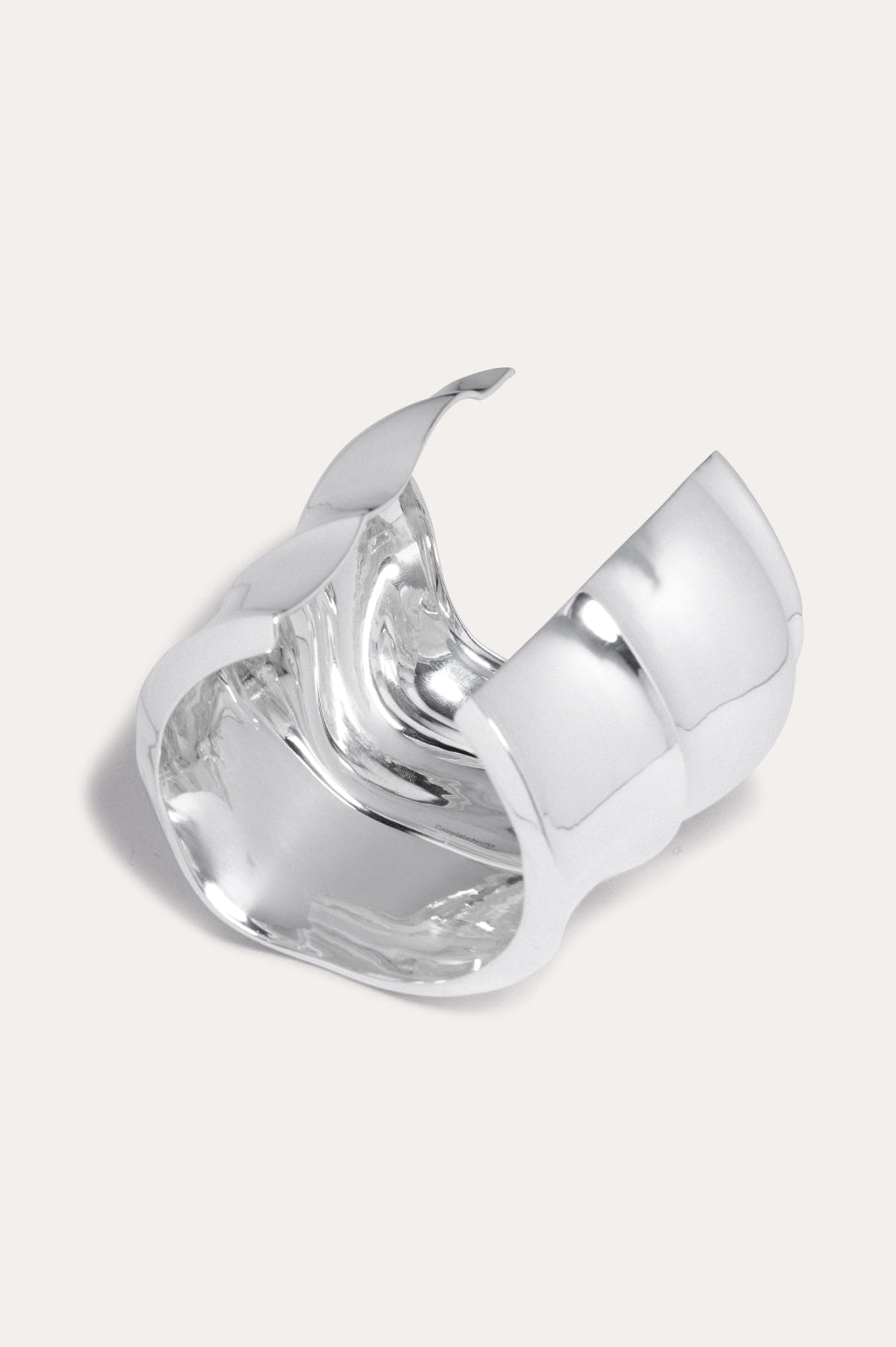 Completed Works sculptural recycled sterling silver plated cuff bracelet designed to make a refined statement at Alas Eius