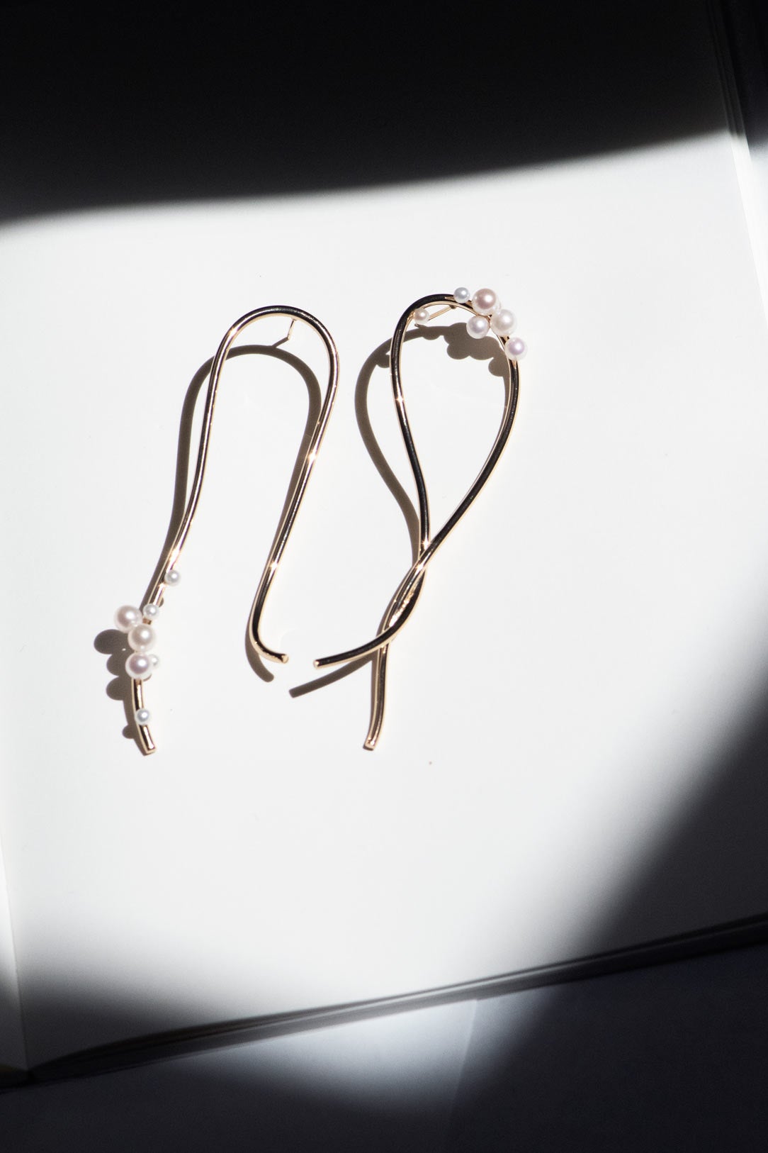 Completed Works freshwater pearl earrings crafted in recycled sterling silver with 14ct yellow gold vermeil and an expressive sculptural design at Alas Eius