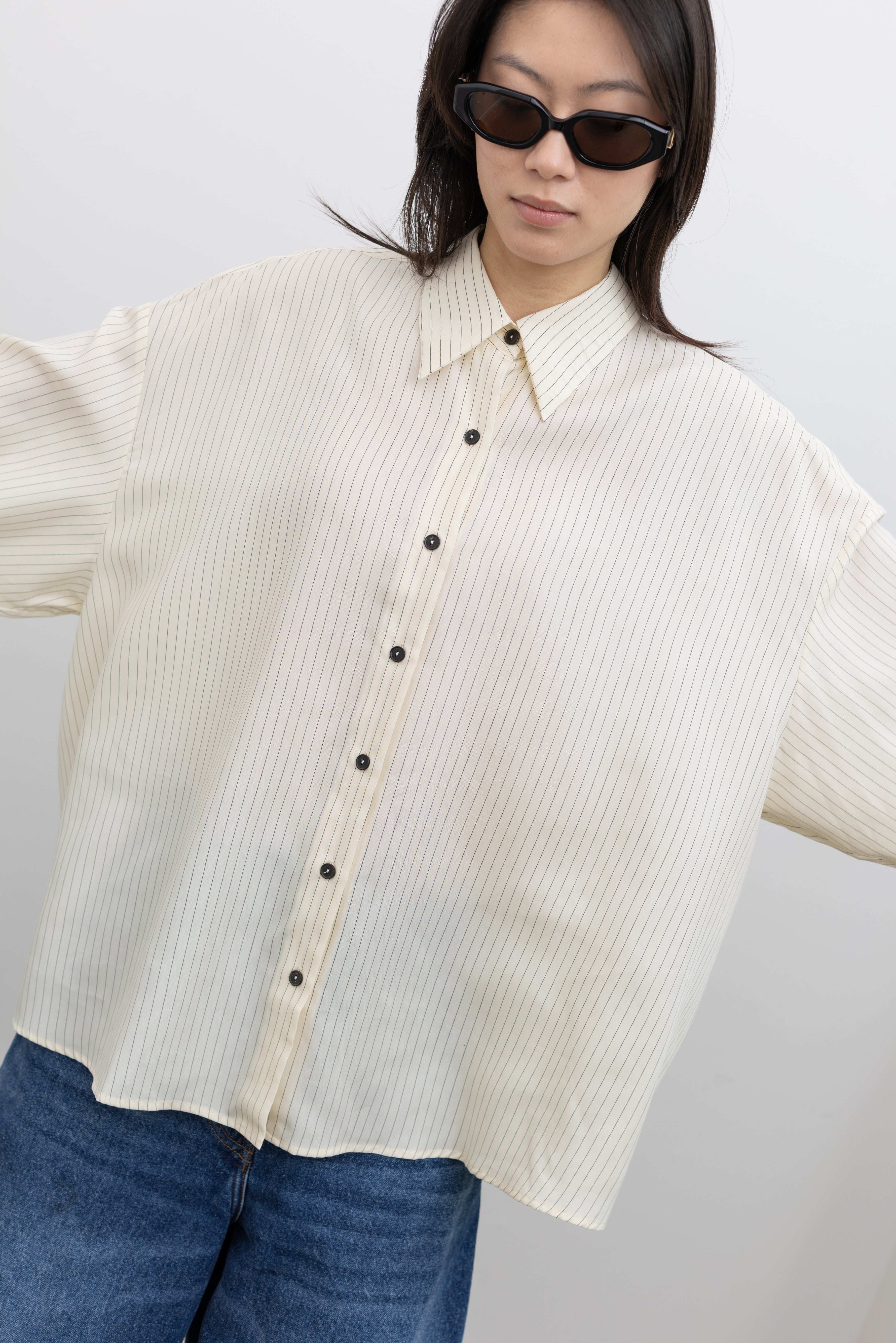 Cordera relaxed-fit striped button-up shirt showcasing luxury minimalist women's fashion at Alas Eius