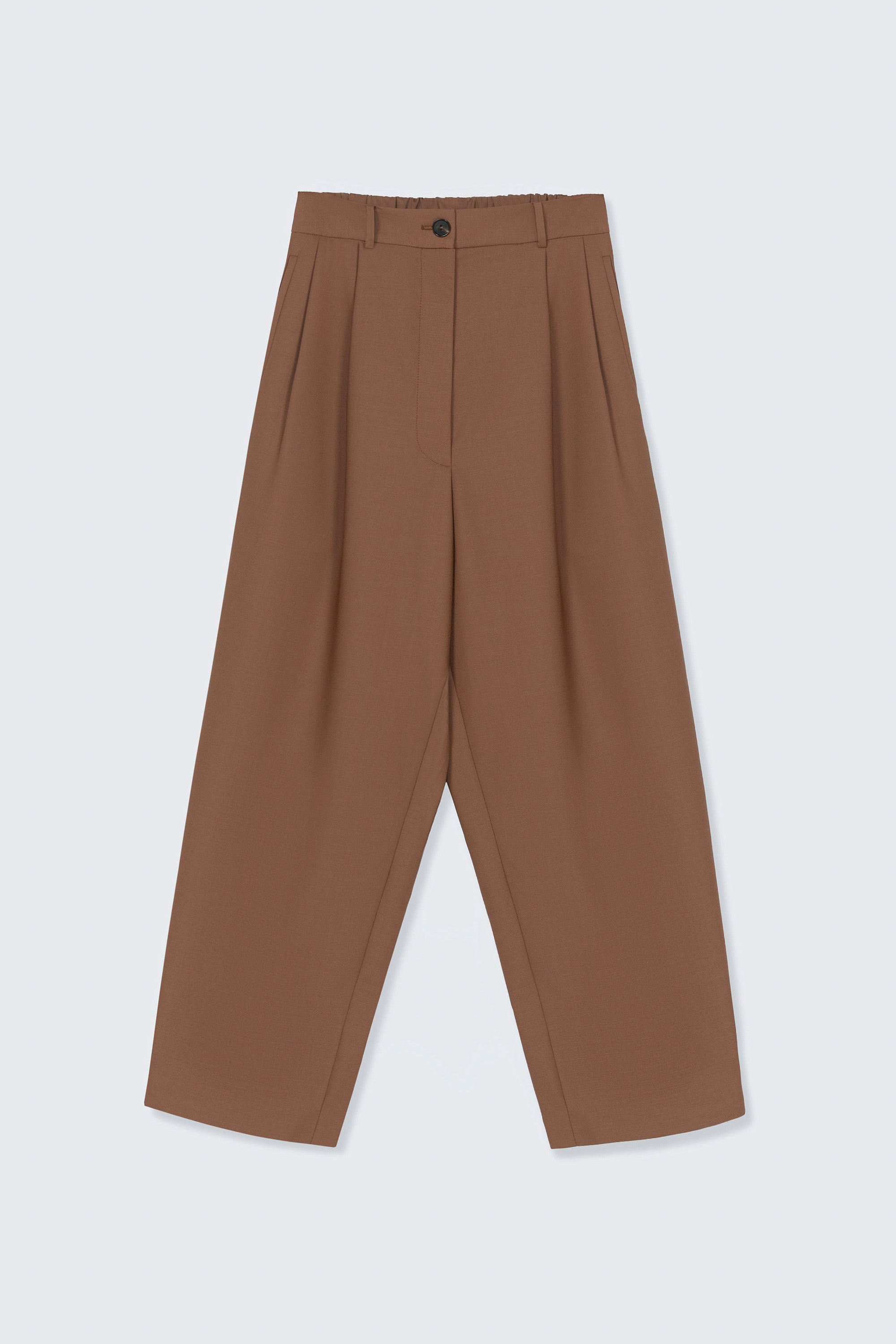Front product view of the Cordera Clove Tailored Masculine Pants featuring a loose, masculine fit with a mid-rise and double front pleats for added structure. Details include jetted side pockets, back welt pockets, an elasticated waistband at the back, zip and button closure, and belt loops at Alas Eius. 