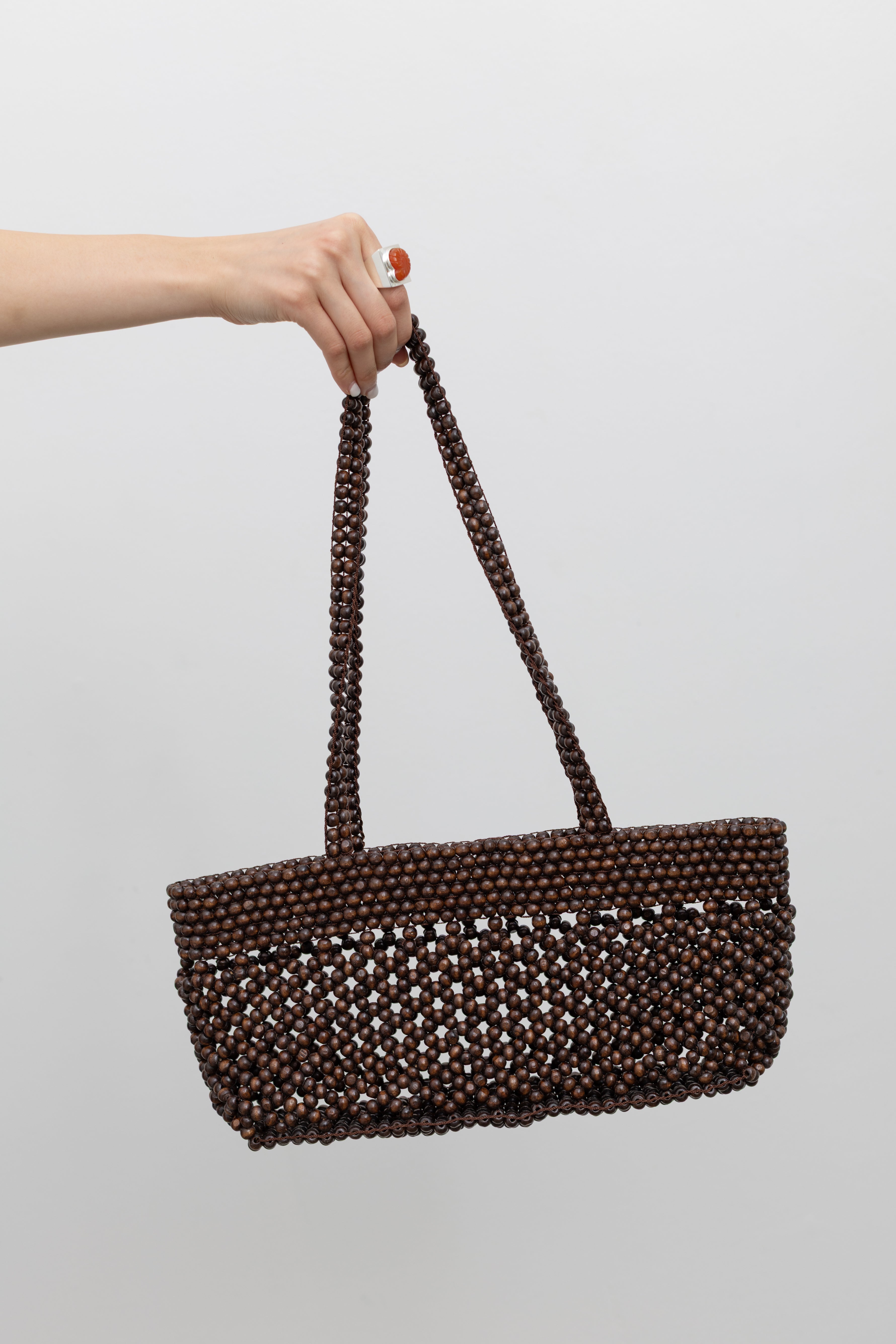 Cordera modern bohemian summer shoulder bag made of hand strung wooden beads at Alas Eius.