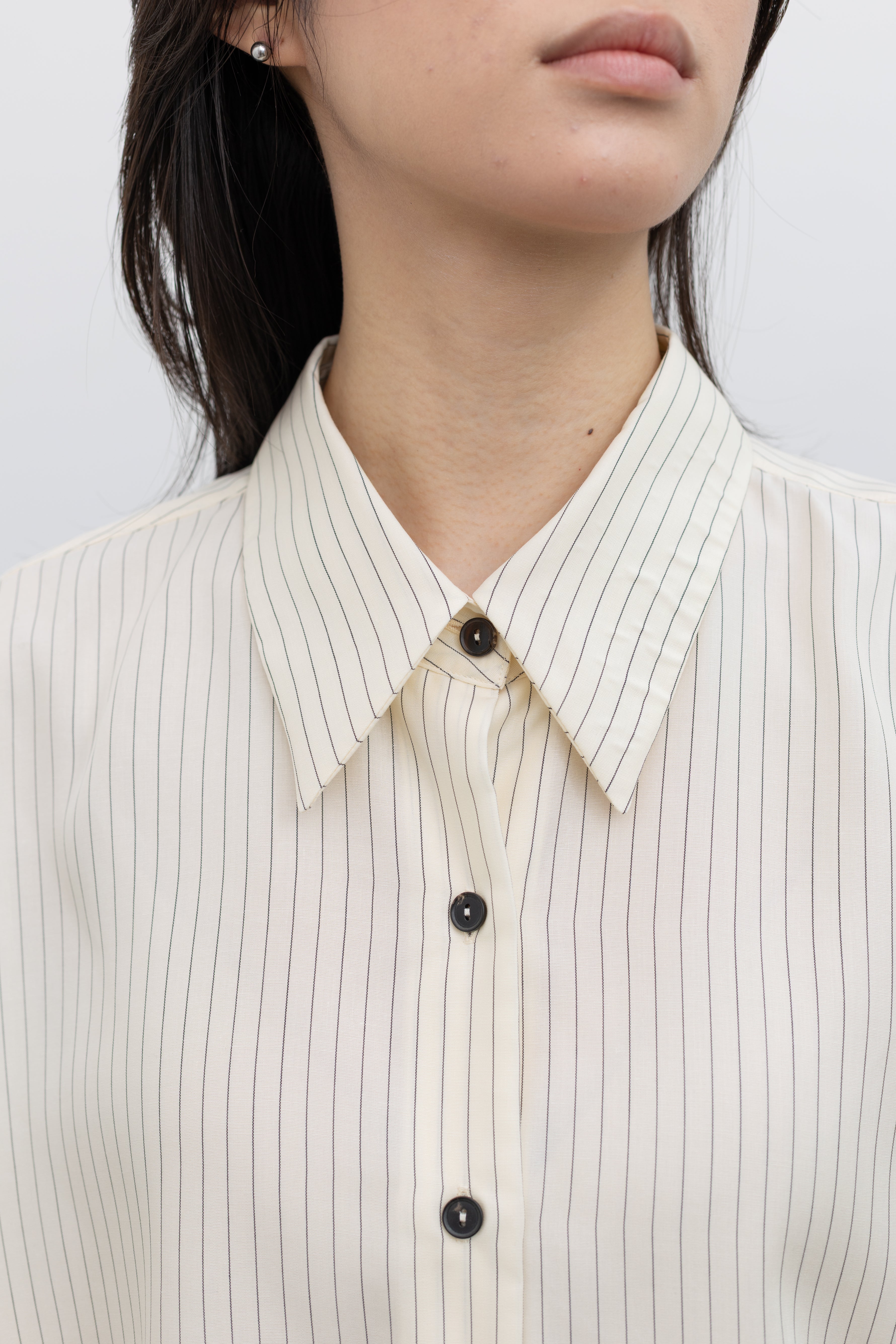 Cordera women's oversized button-front shirt in classic pencil stripe fabric with modern tailoring at Alas Eius