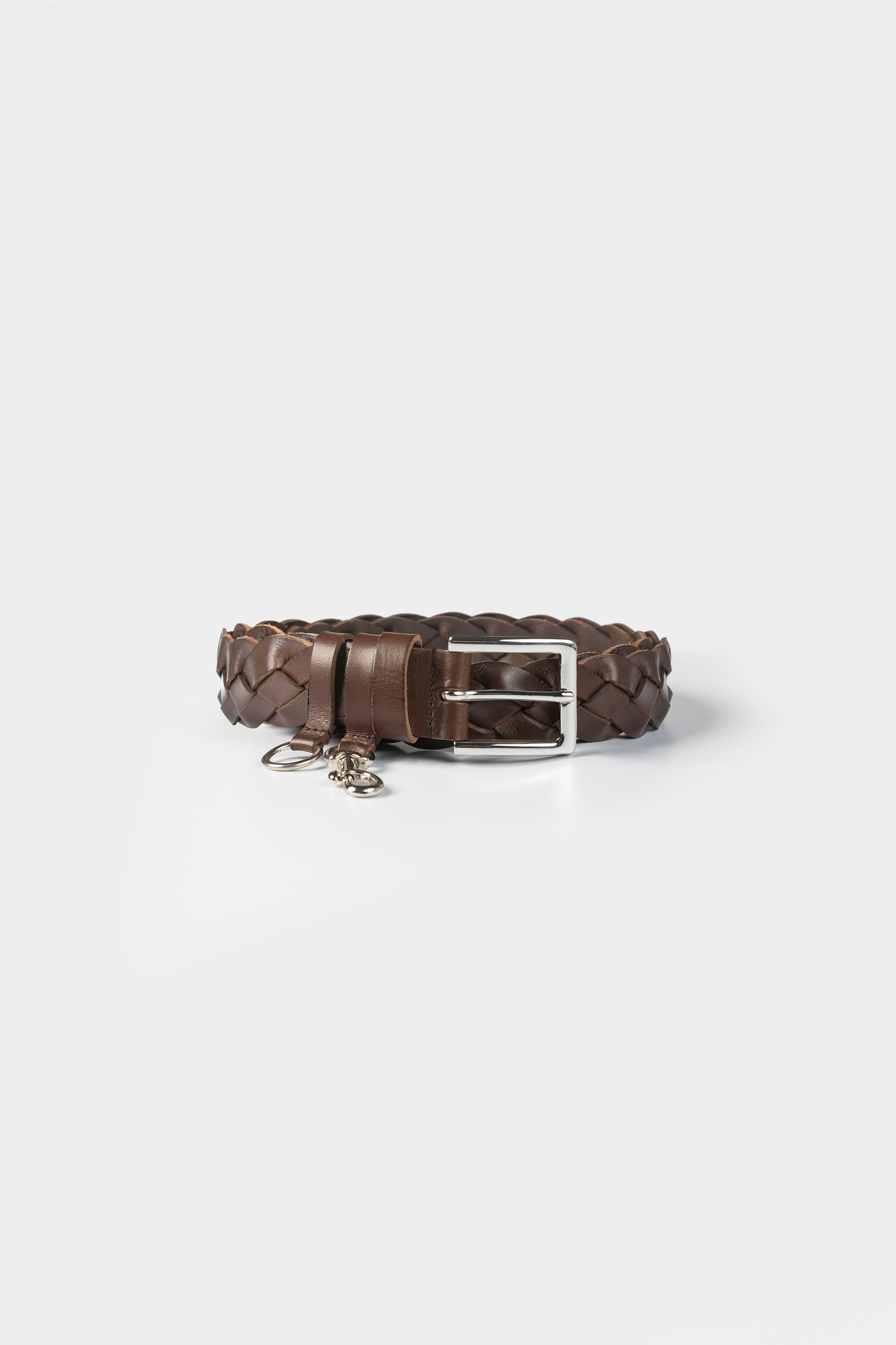 Cordera classic woven leather belt with smooth leather details and silver hardware, elevated everyday style at Alas Eius