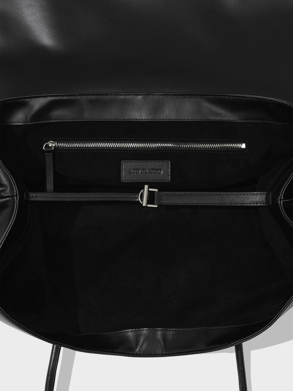 Black Low Classic Haricot mini bag with magnetic flap closure at Alas Eius