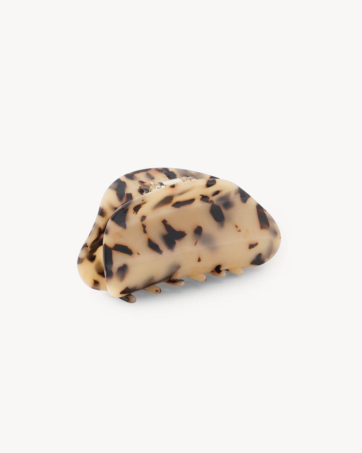 Machete Crescent Claw Blonde Tortoise hair claw with sculptural curved design at Alas Eius