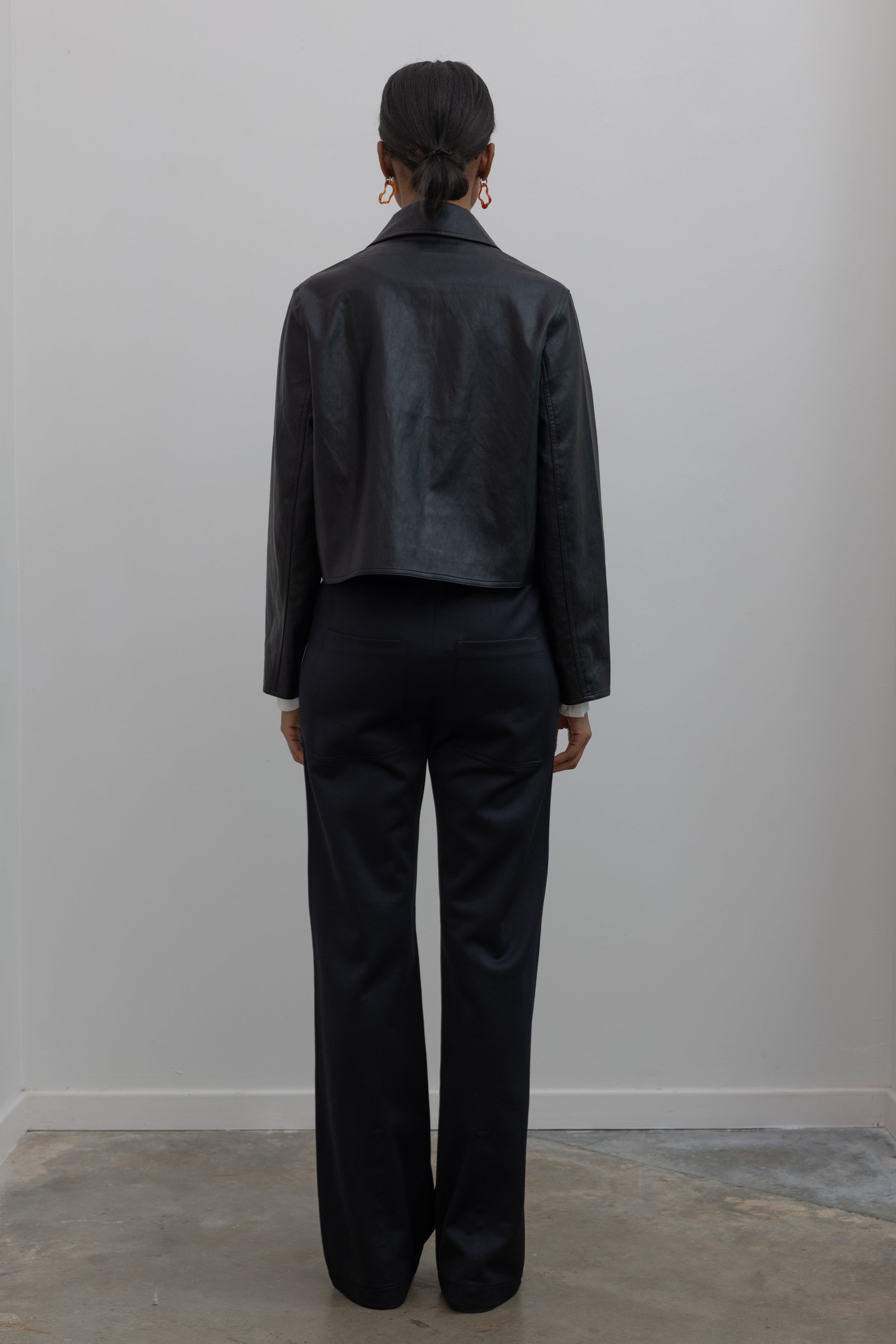 clean black leather jacket with tibi pants at alas eius