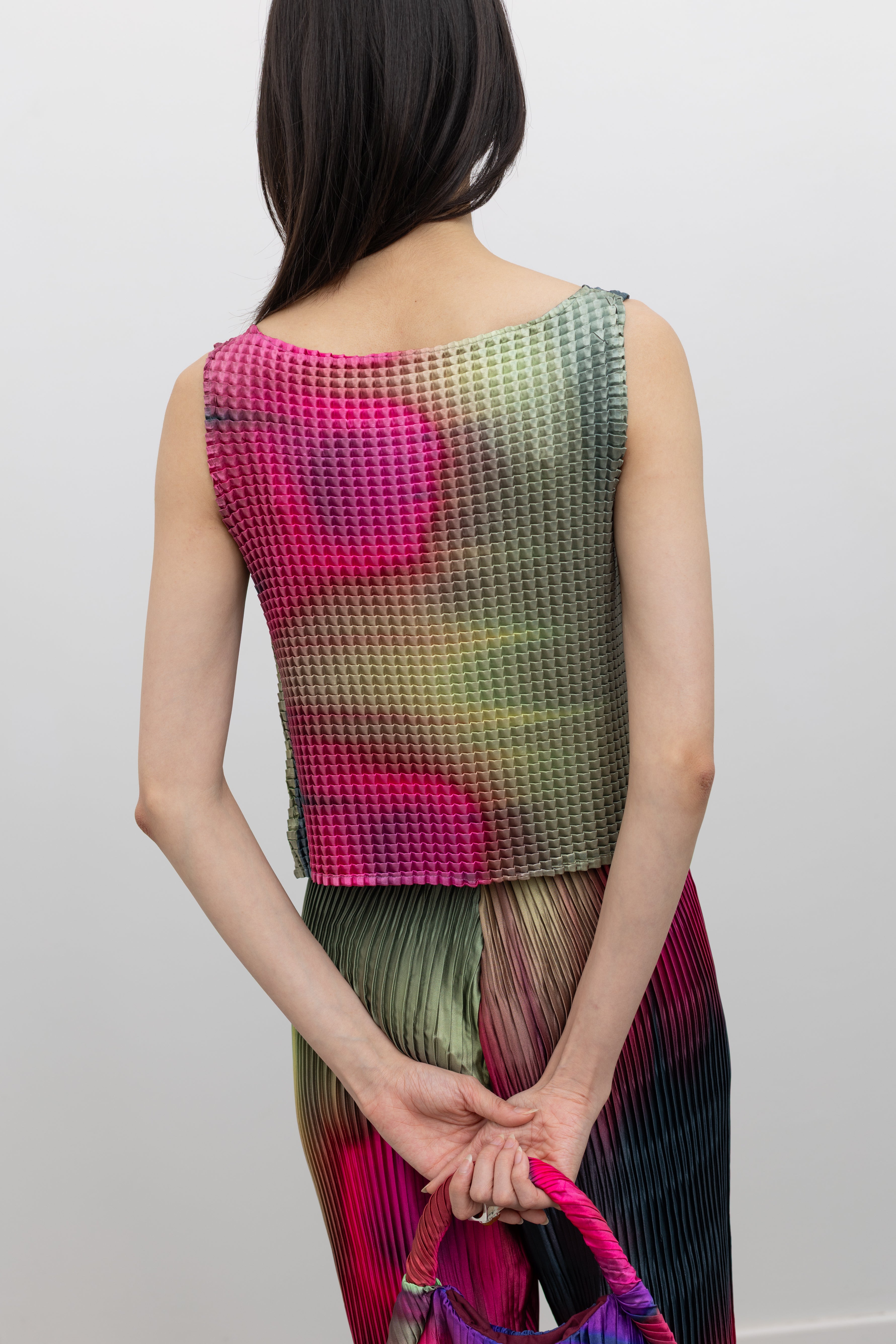 Nin Studio sculptural pleated tank top with vibrant hues and lightweight movement, an eye-catching luxury women's apparel essential at Alas Eius