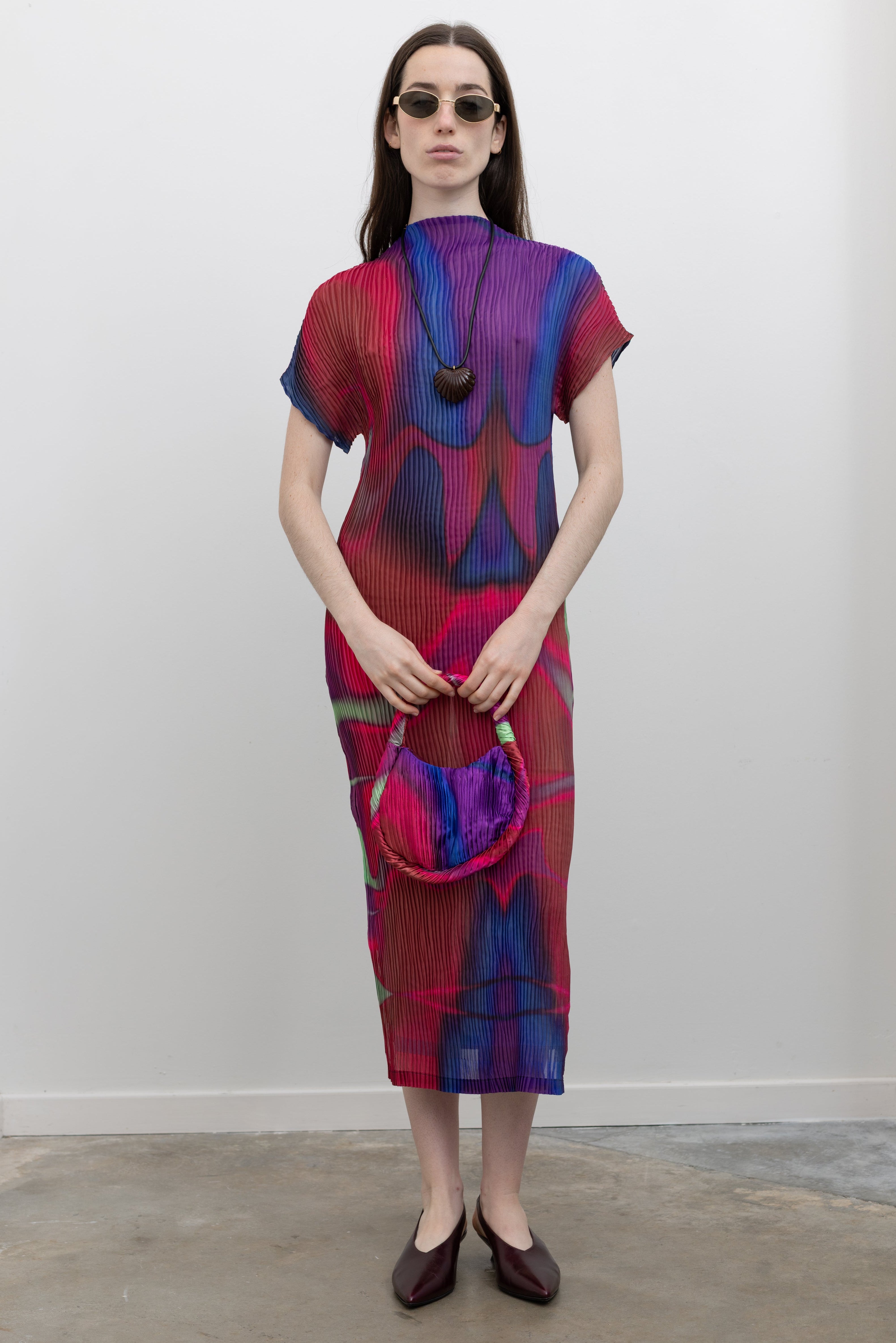 Nin Studio wave pleat midi dress in a vibrant hue featuring sculptural texture, mid-length sleeves, and a fluid silhouette, a standout women's designer dress with artistic movement and modern elegance at Alas Eius