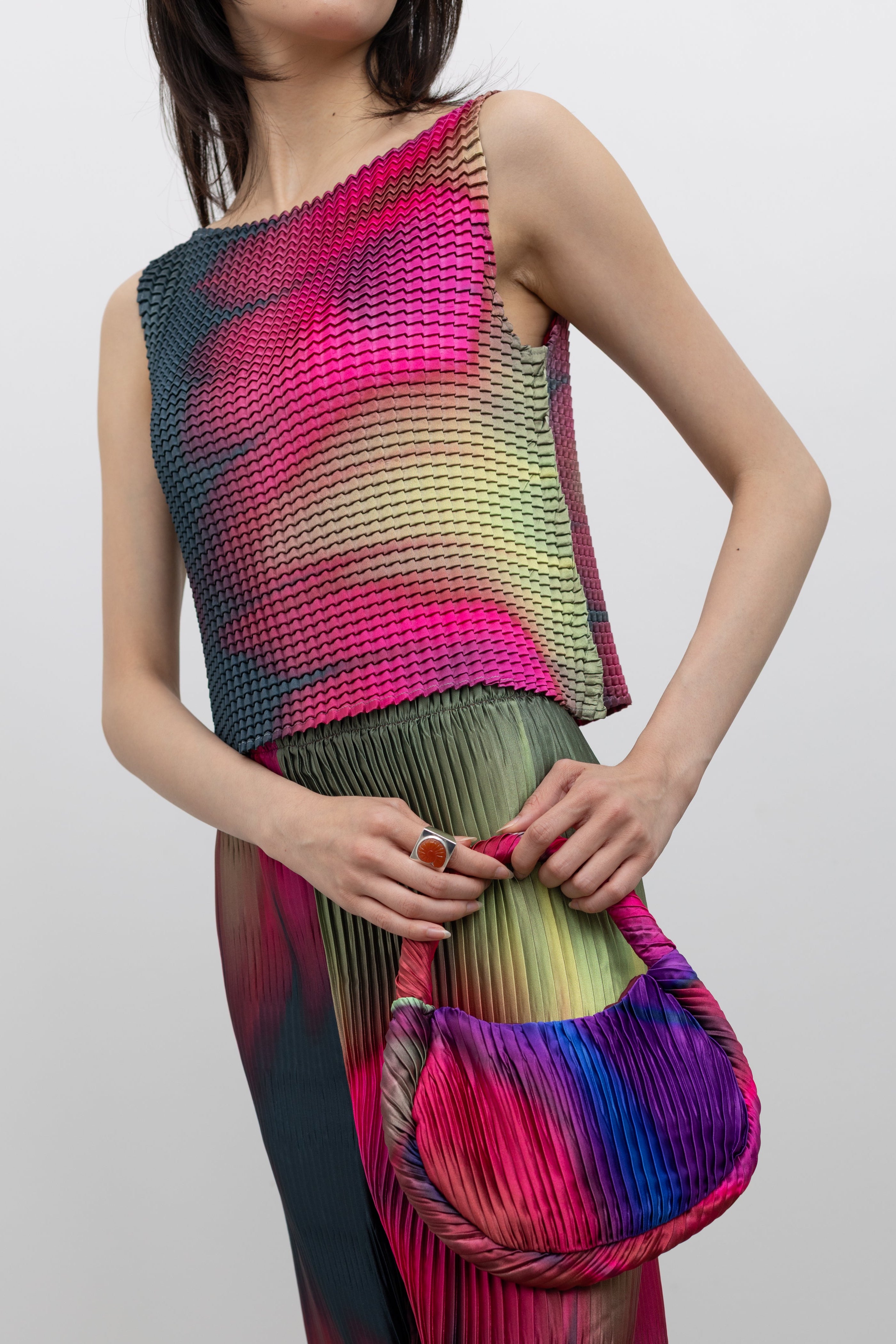 Nin Studio wave pleat sleeveless top featuring vibrant color and sculptural texture, a contemporary women's fashion statement for elevated everyday dressing at Alas Eius