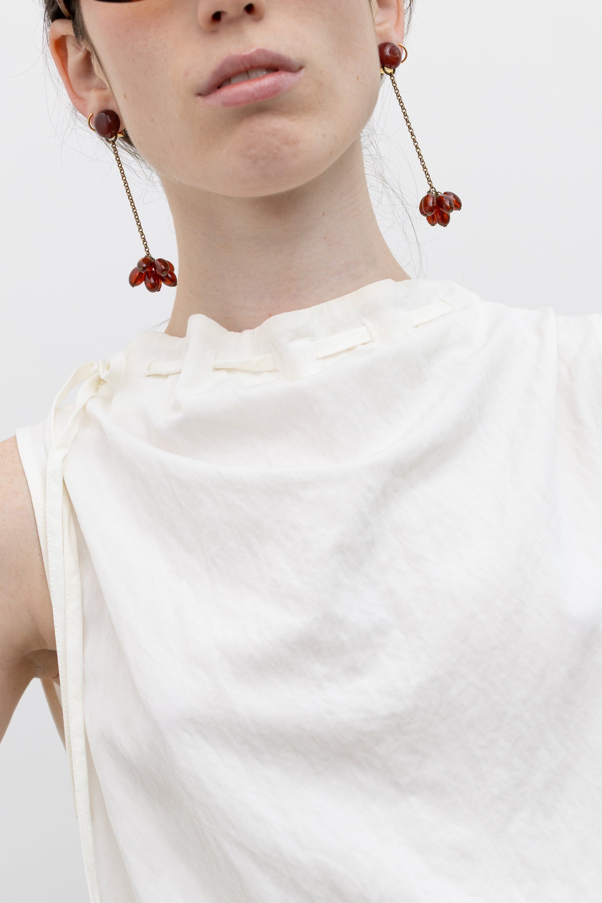 Rachel Comey beaded drop earrings with oval bead clusters and fine chain detailing, styled as modern women's statement jewelry at Alas Eius