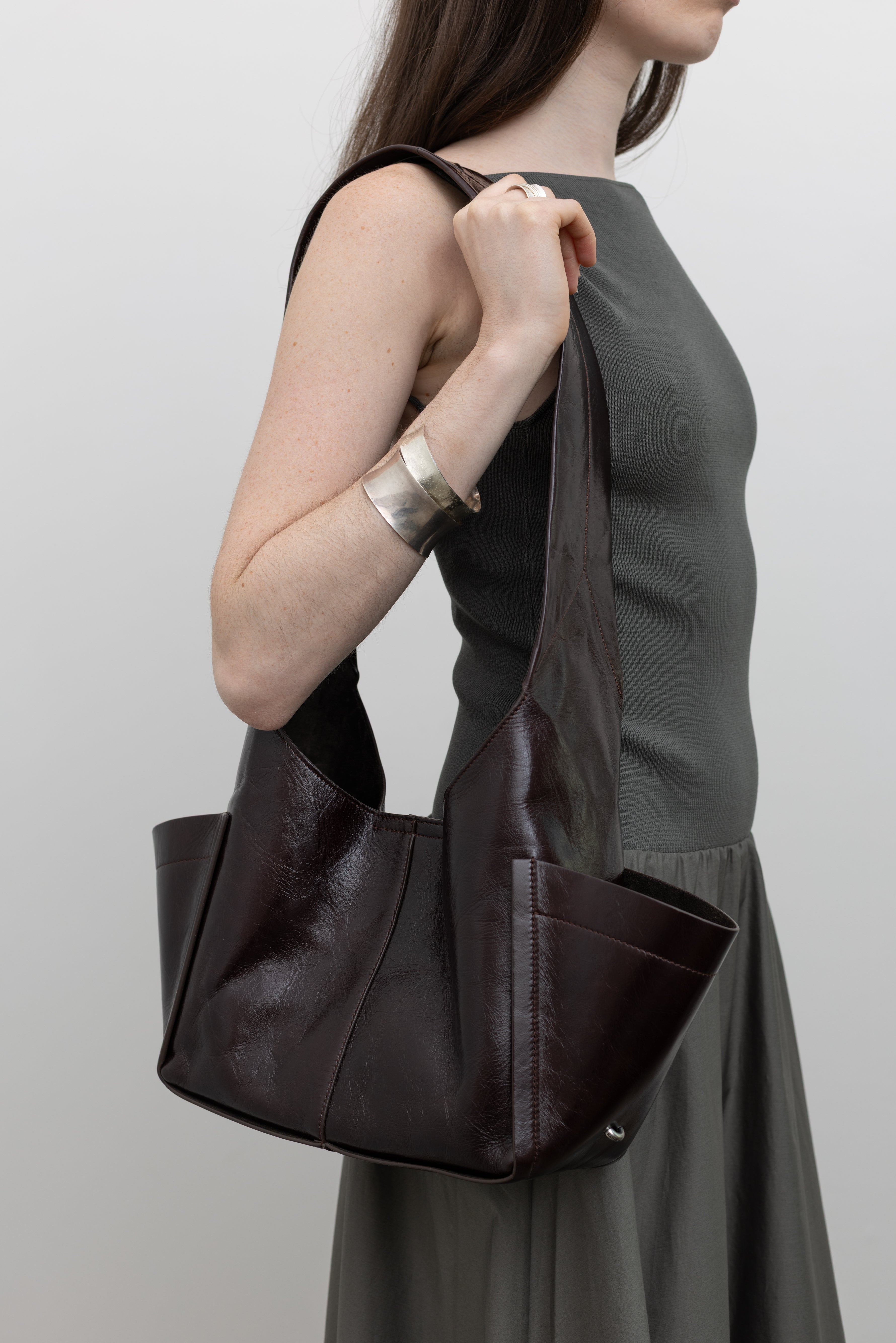 Rachel Comey sculptural crossbody bag featuring magnetic closure and utility pockets, perfect for contemporary women's everyday luxury accessories at Alas Eius