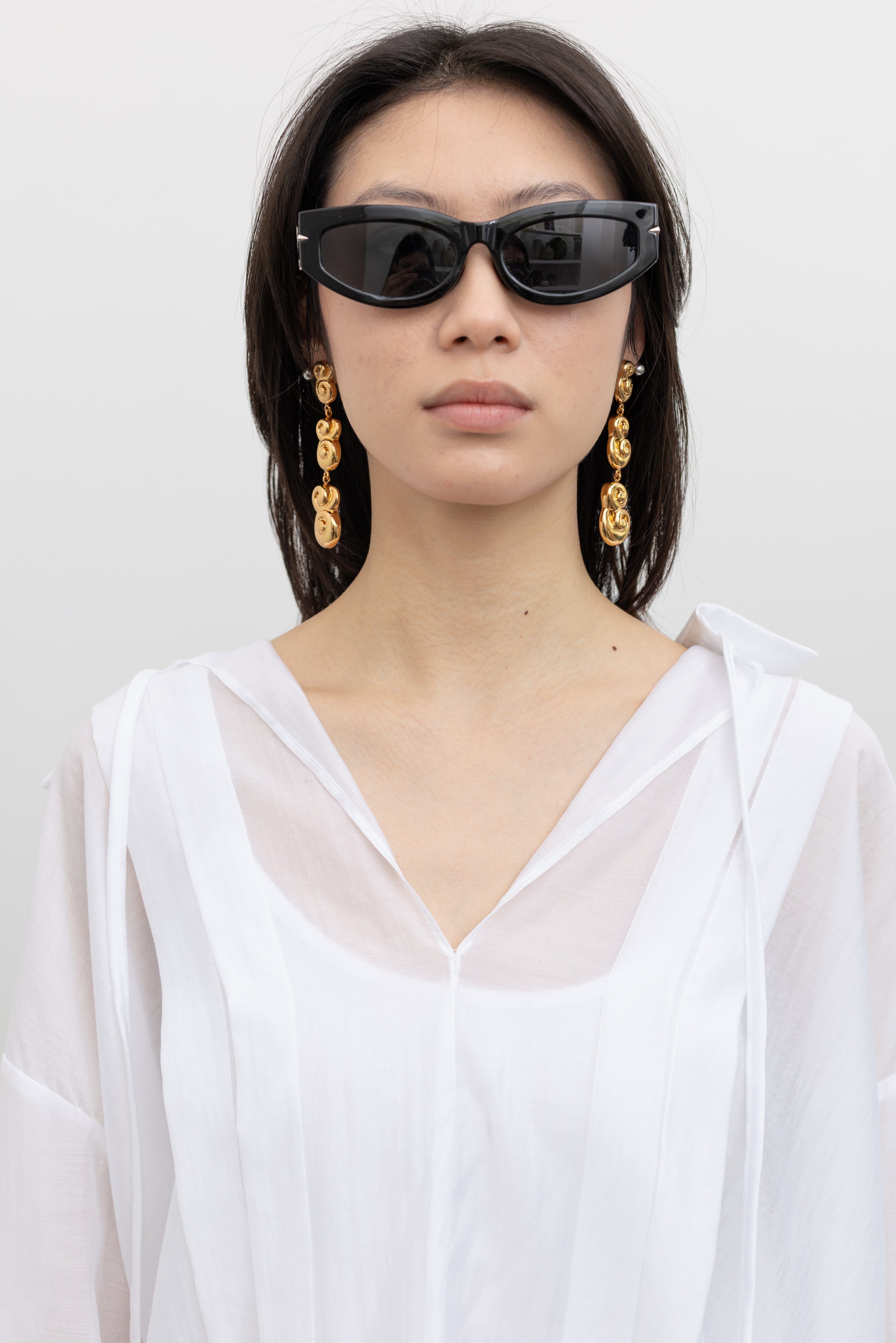 Rachel Comey sculptural drop earrings featuring textured gold-tone detailing and contemporary women's luxury accessories at Alas Eius