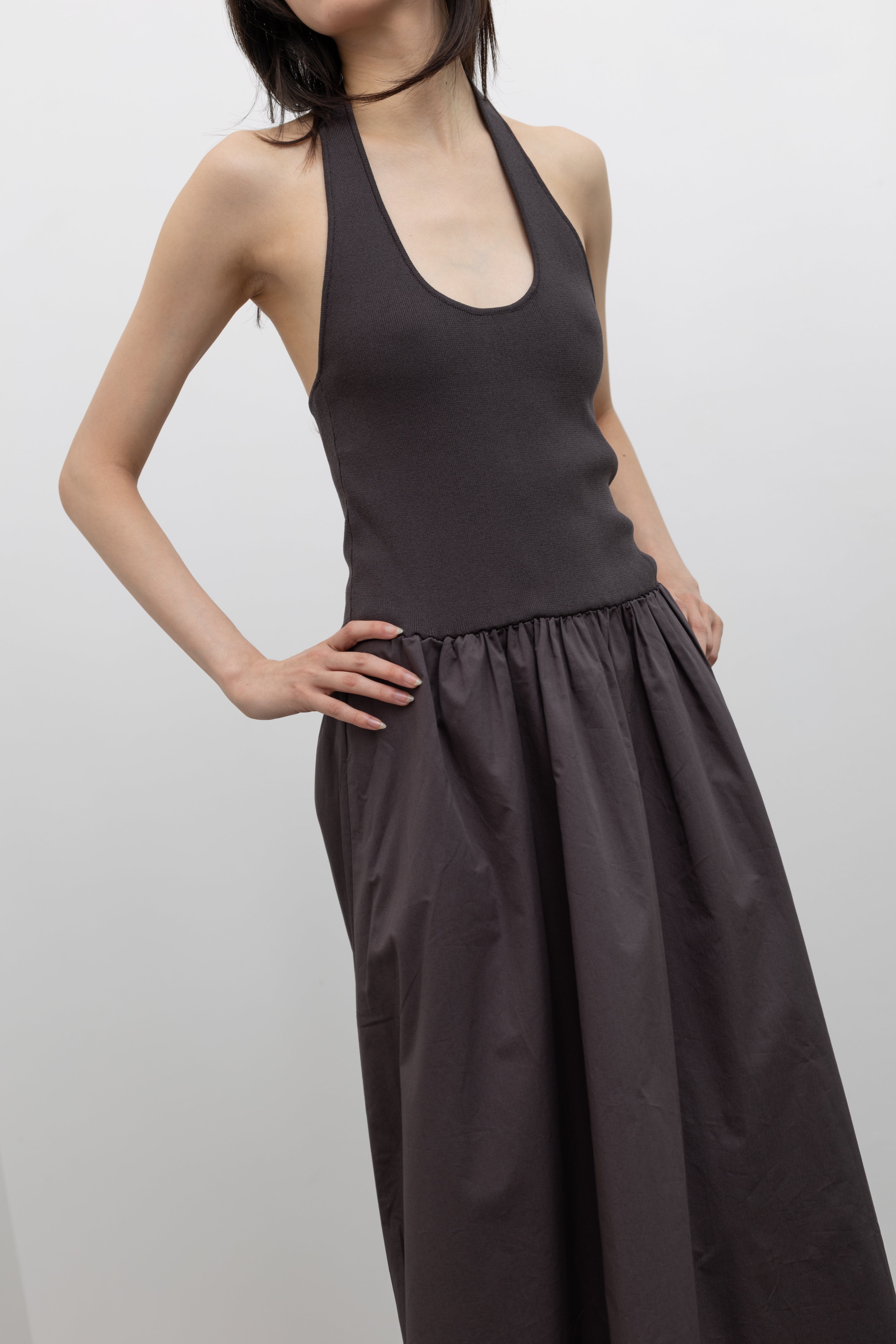 St. Agni black halter maxi dress with a streamlined knit top and gathered skirt at Alas Eius.