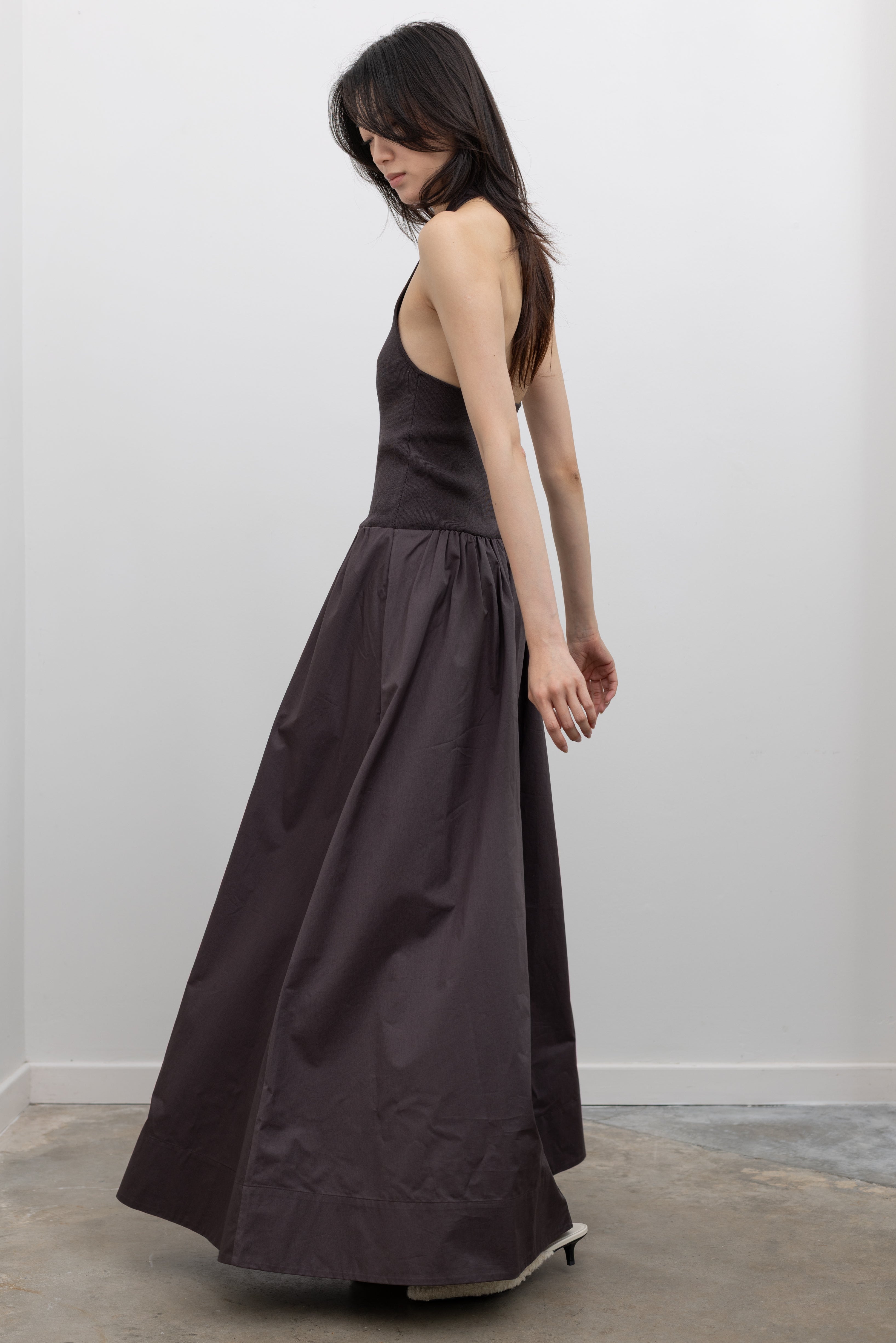 St. Agni maxi dress with a fitted knit bodice, gathered waist, and flowing silhouette at Alas Eius. 