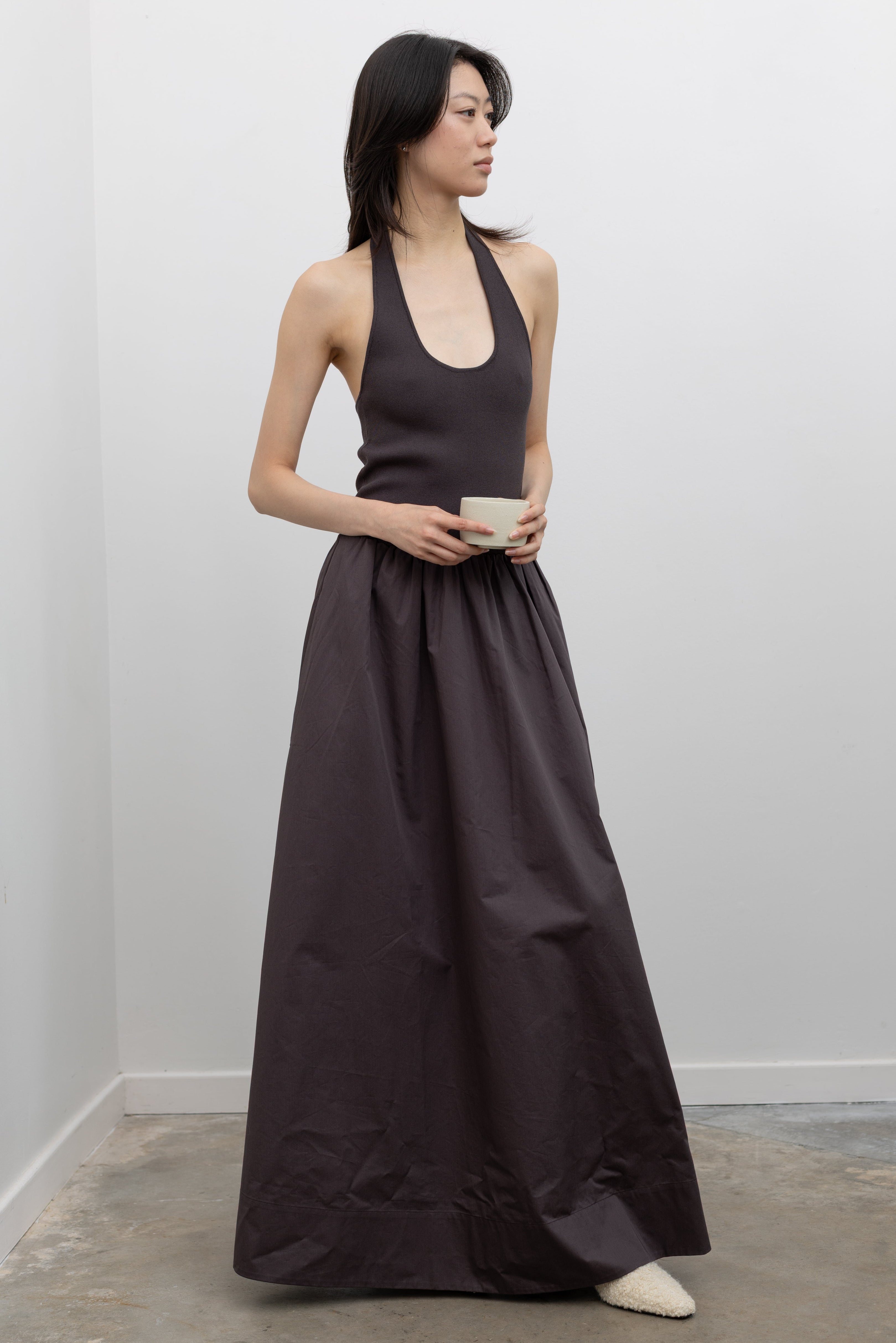 St. Agni Halter Gathered Dress featuring a fitted knit bodice, scoop halter neckline, and gathered maxi poplin skirt at Alas Eius.