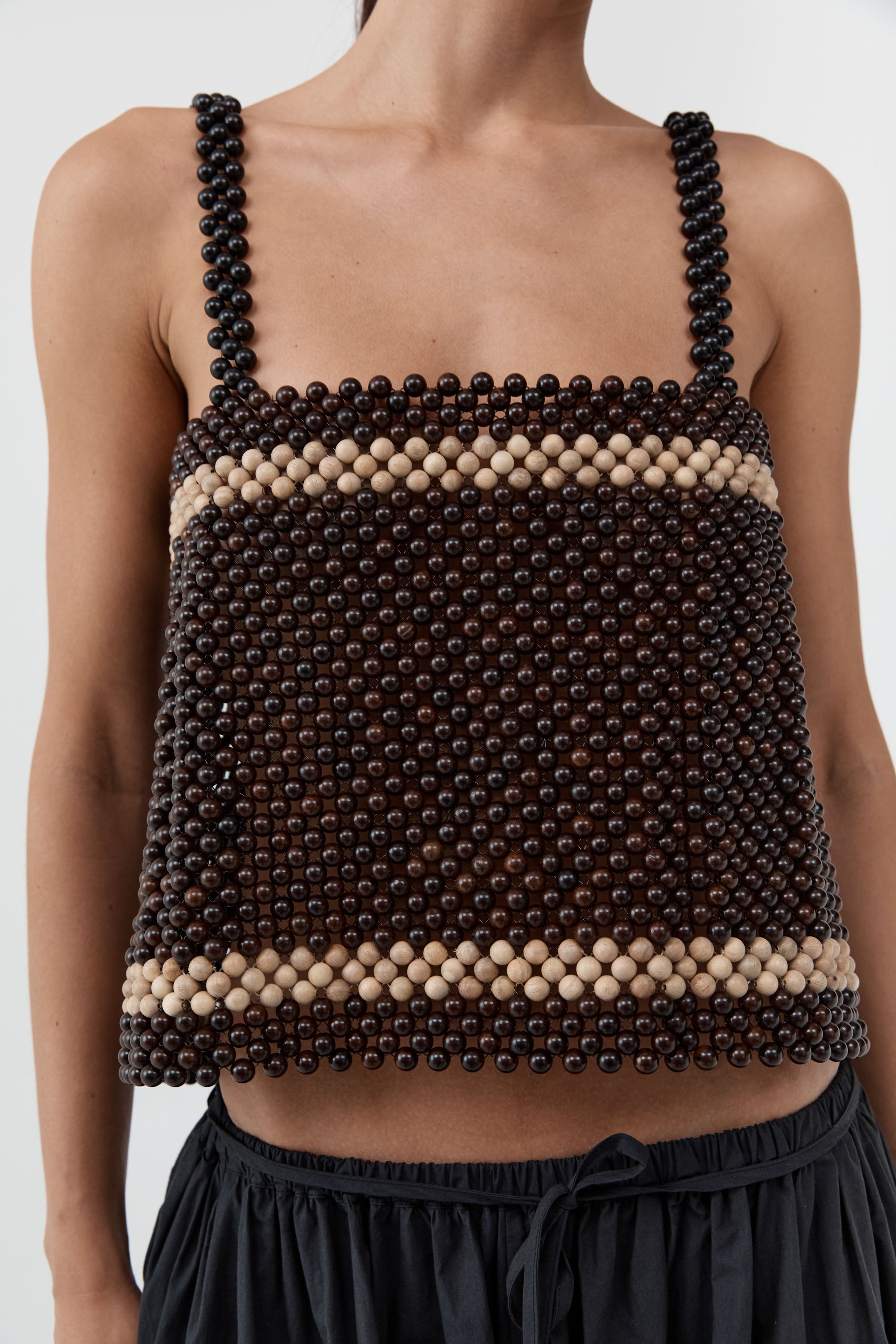 St. Agni minimalist square neckline top with wooden beads at Alas Eius