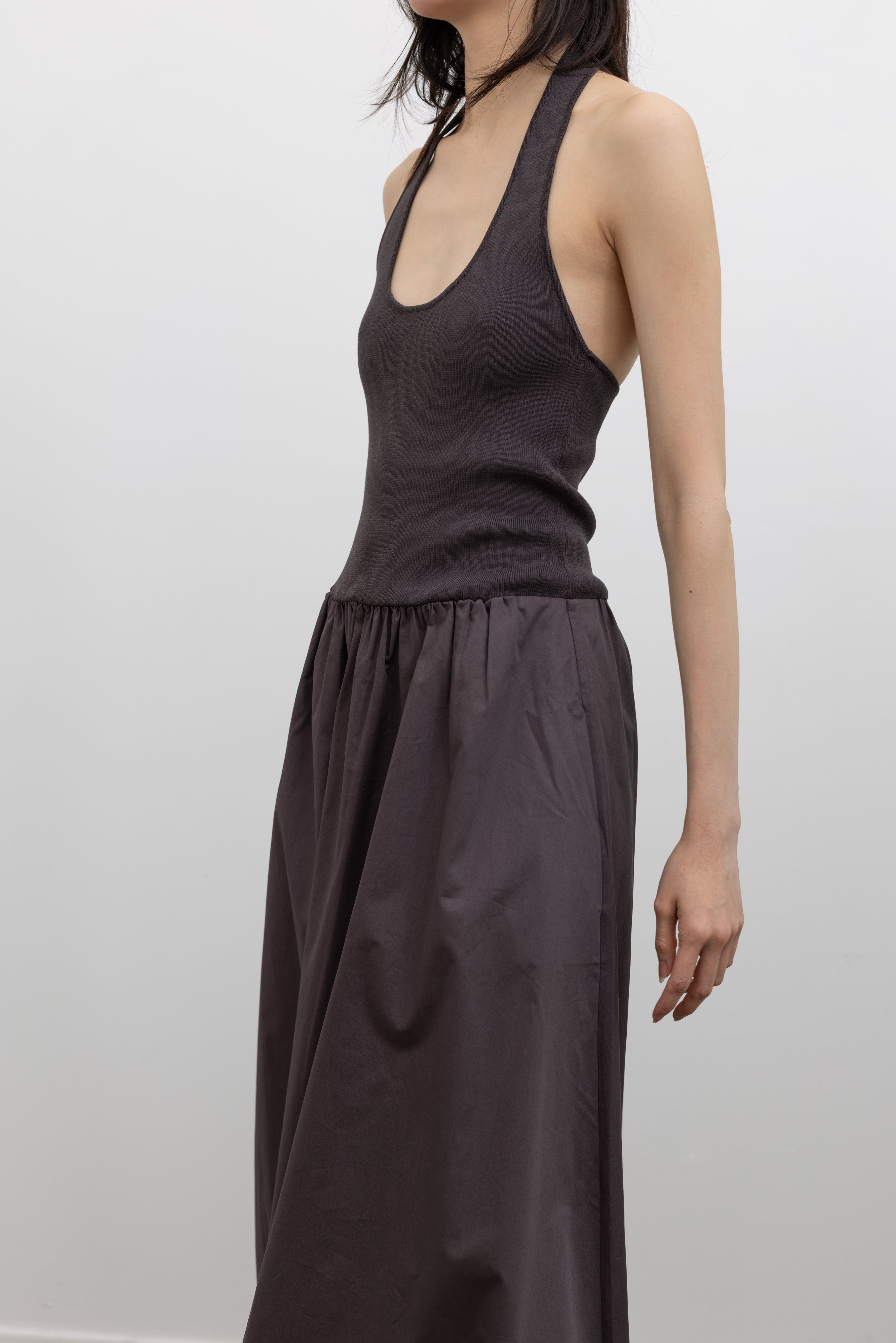 St. Agni Chocolate Halter Gathered Dress featuring a modern scoop halter neckline and voluminous skirt at Alas Eius.