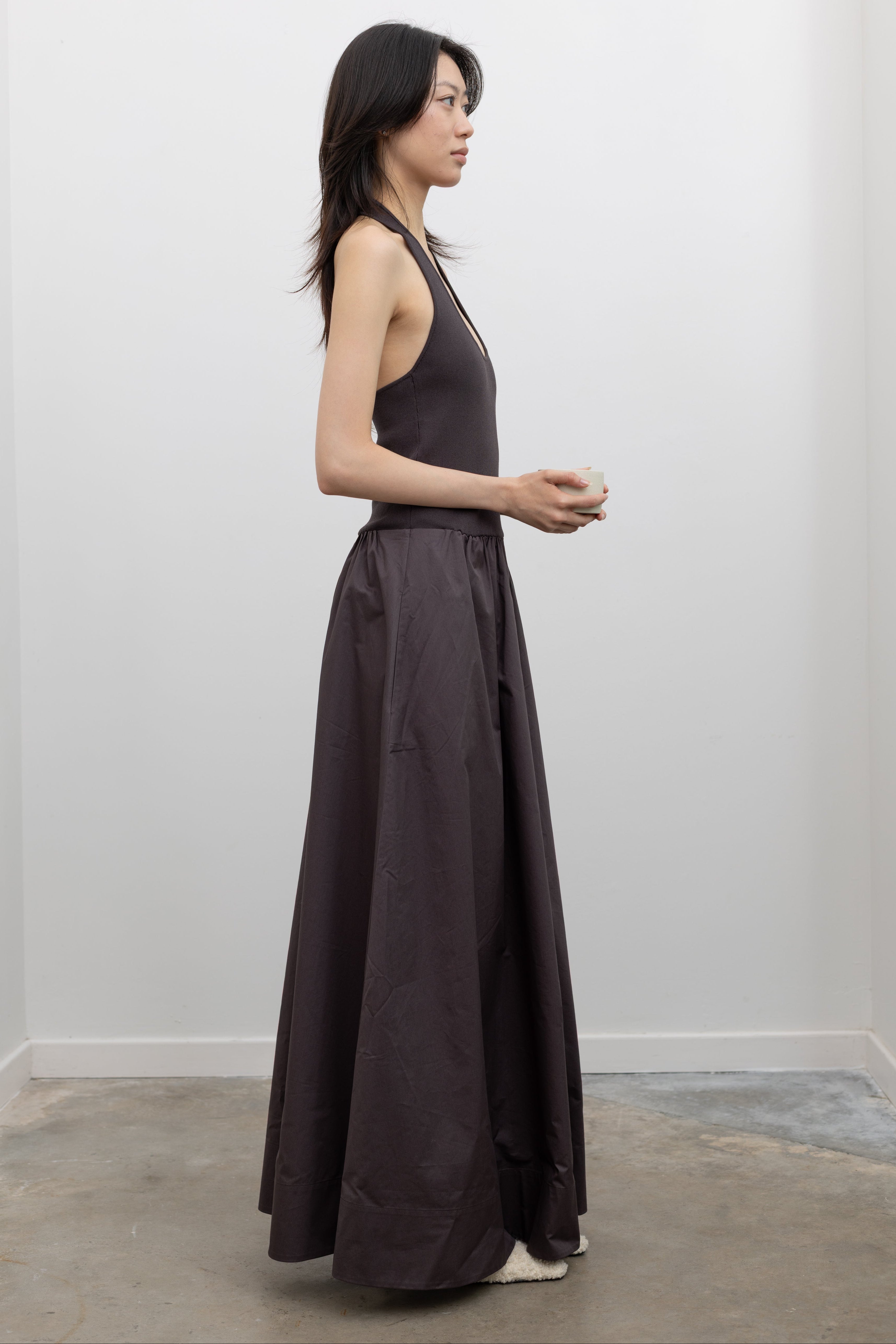 St. Agni sleeveless halter dress with a scoop neckline and softly gathered poplin skirt at Alas Eius.