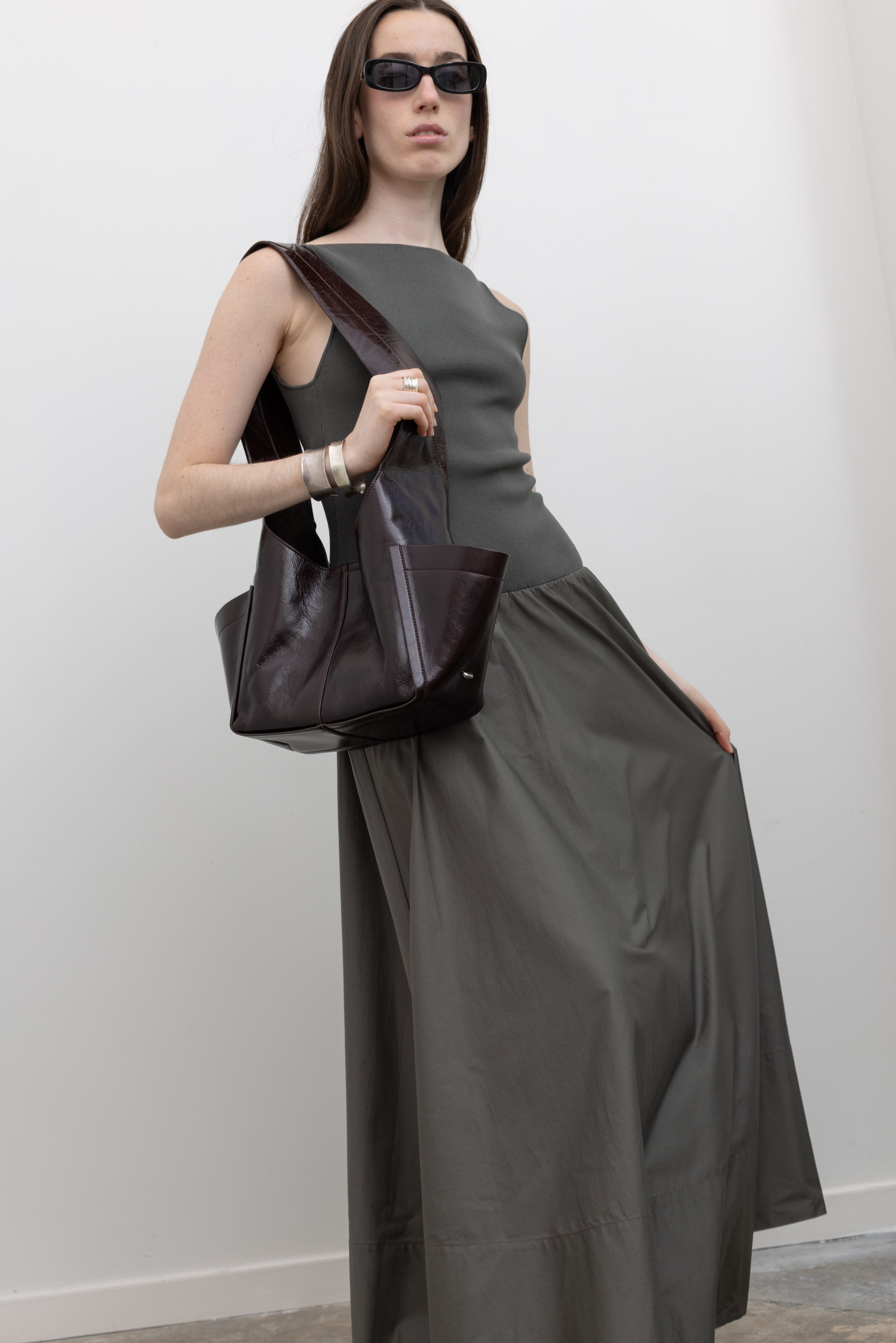 St. Agni women's black maxi dress featuring a square neckline, open back, knitted bodice, and gathered poplin skirt at Alas Eius.