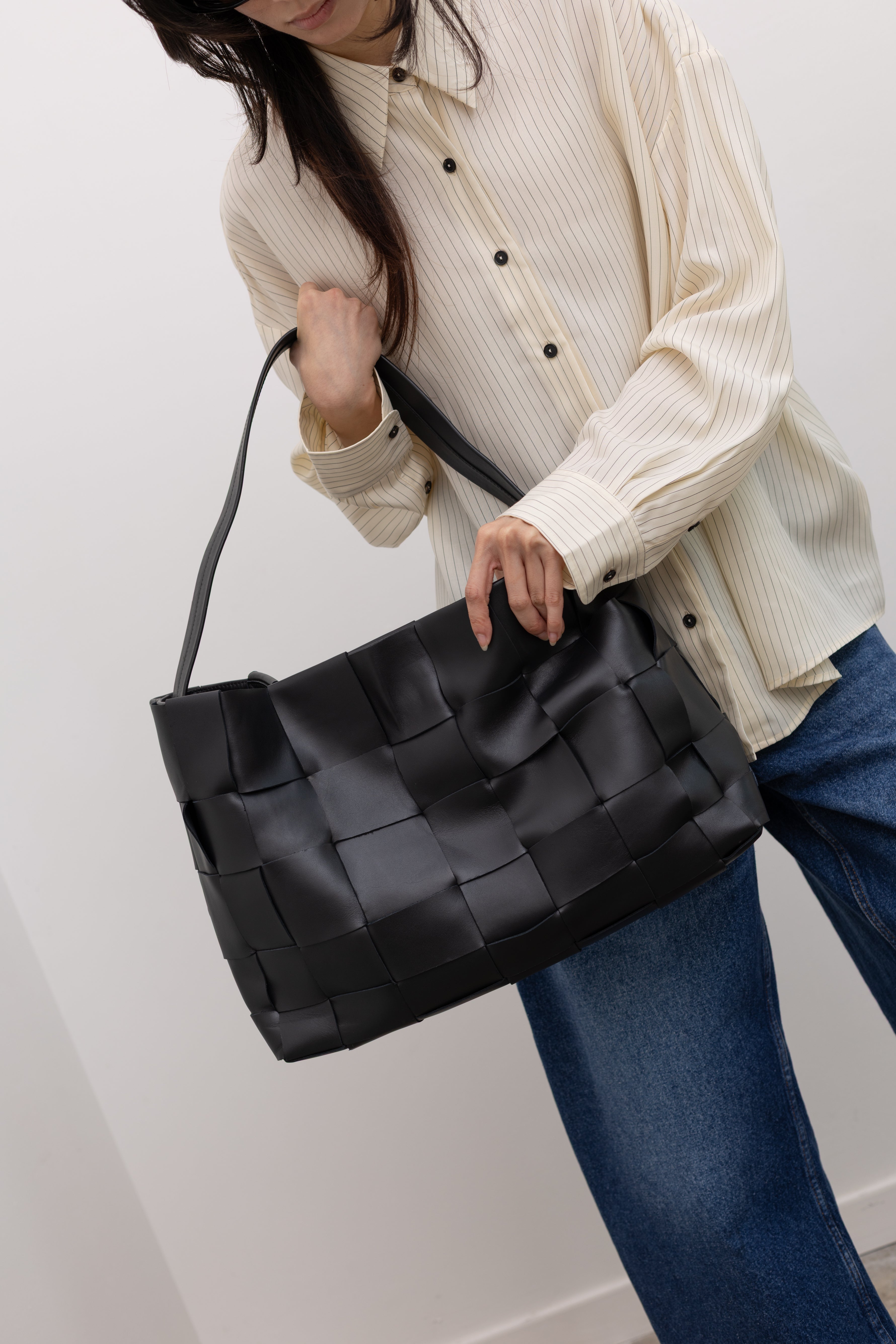 St. Agni woven leather tote bag crafted for modern women's minimalist fashion and everyday luxury styling at Alas Eius