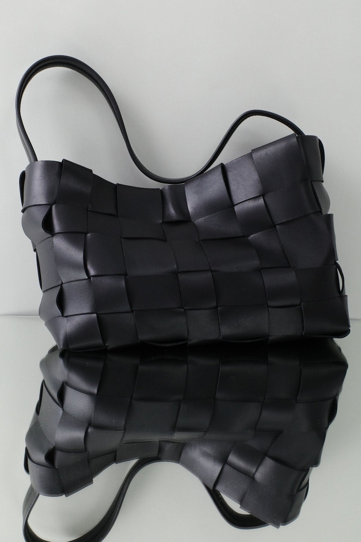 St. Agni woven tote handbag styled as a versatile women's everyday carryall with quiet luxury appeal at Alas Eius