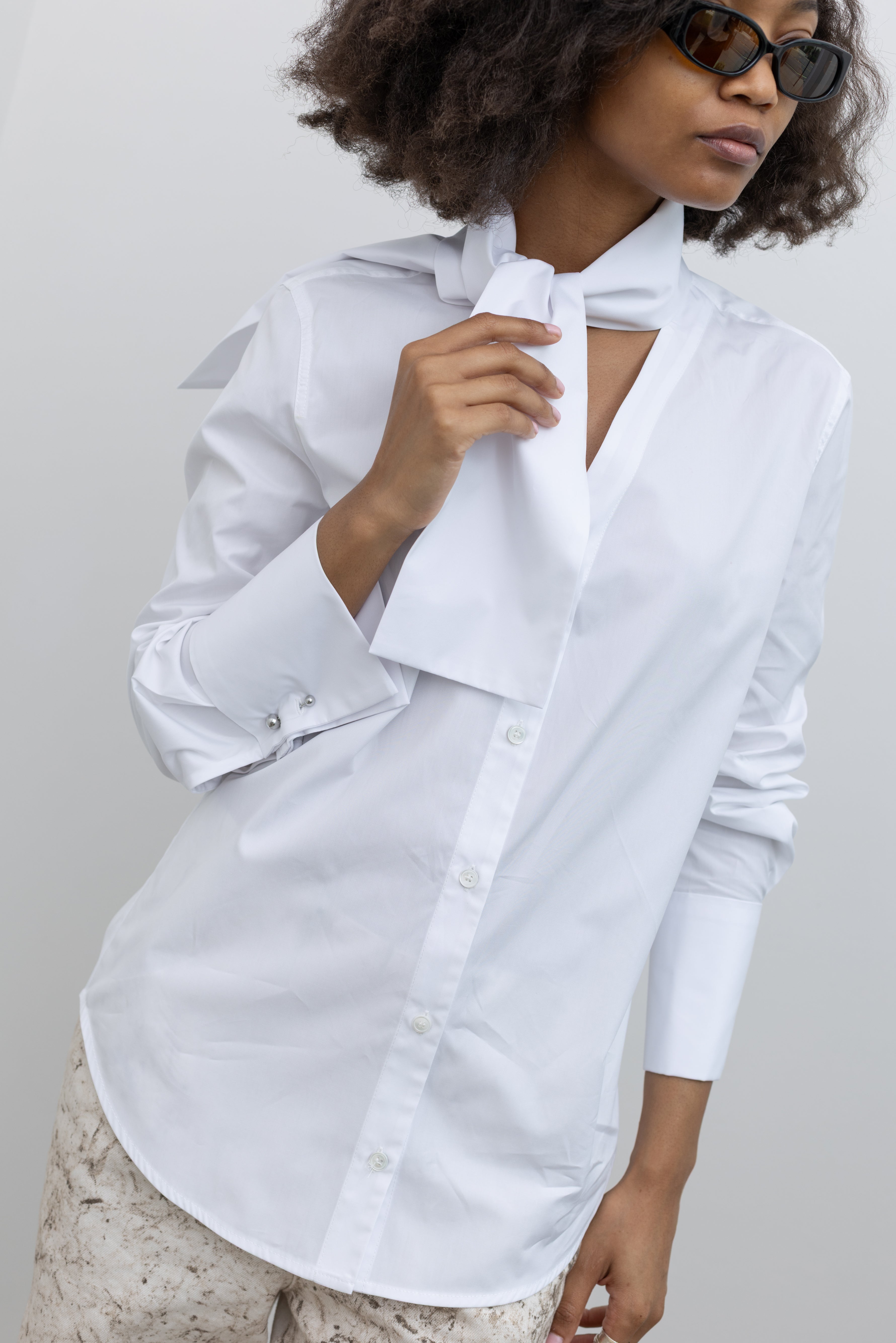 Tela Deanna Italian-designed cotton shirt with a polished silhouette and elegant neck tie accent at alas eius.