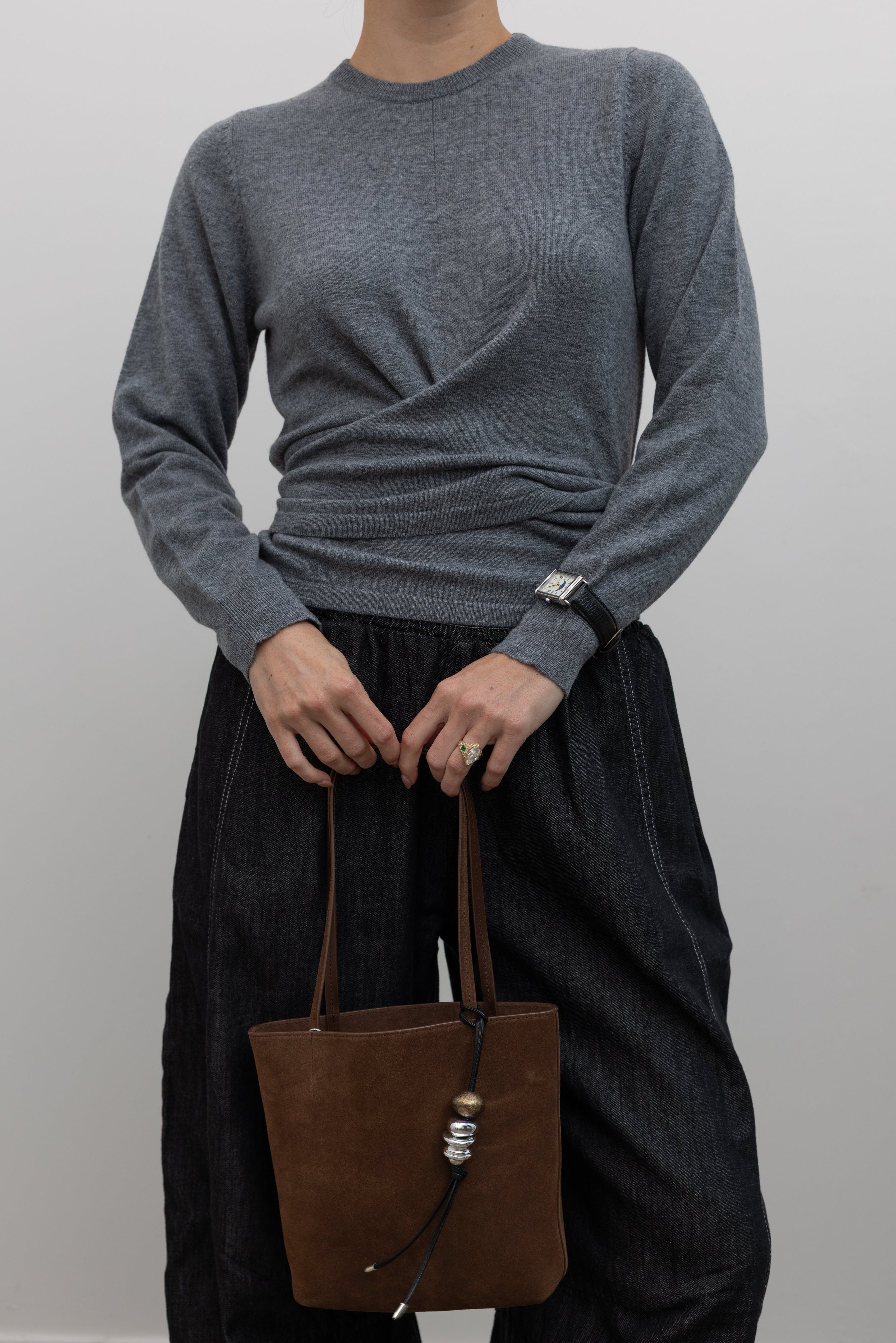 TELA grey melange carded wool wrap knit top with asymmetric hem at Alas Eius