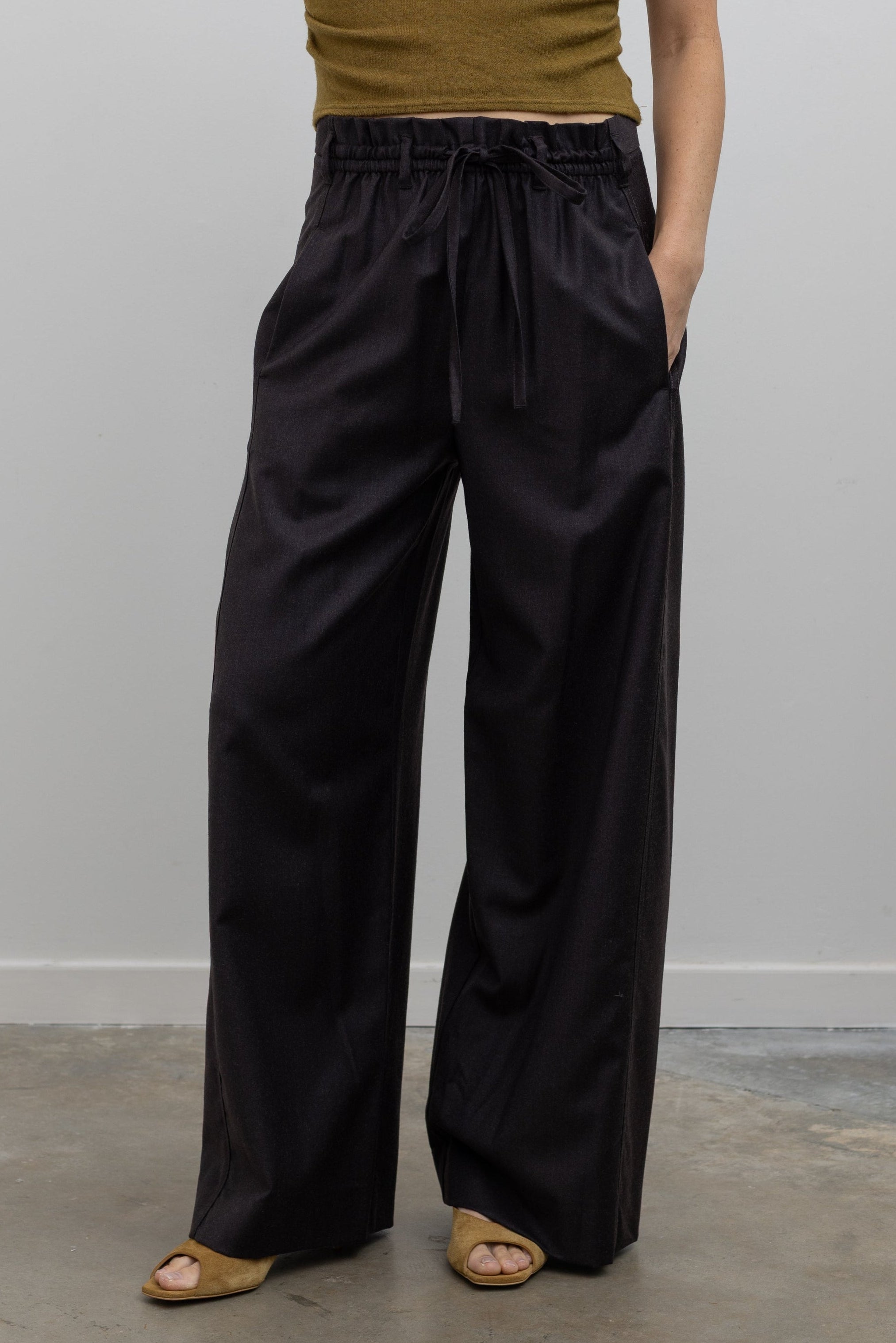 Tela Lucio dark brown wool-blend wide-leg pant with a drawstring waistband and side pockets at alas eius.