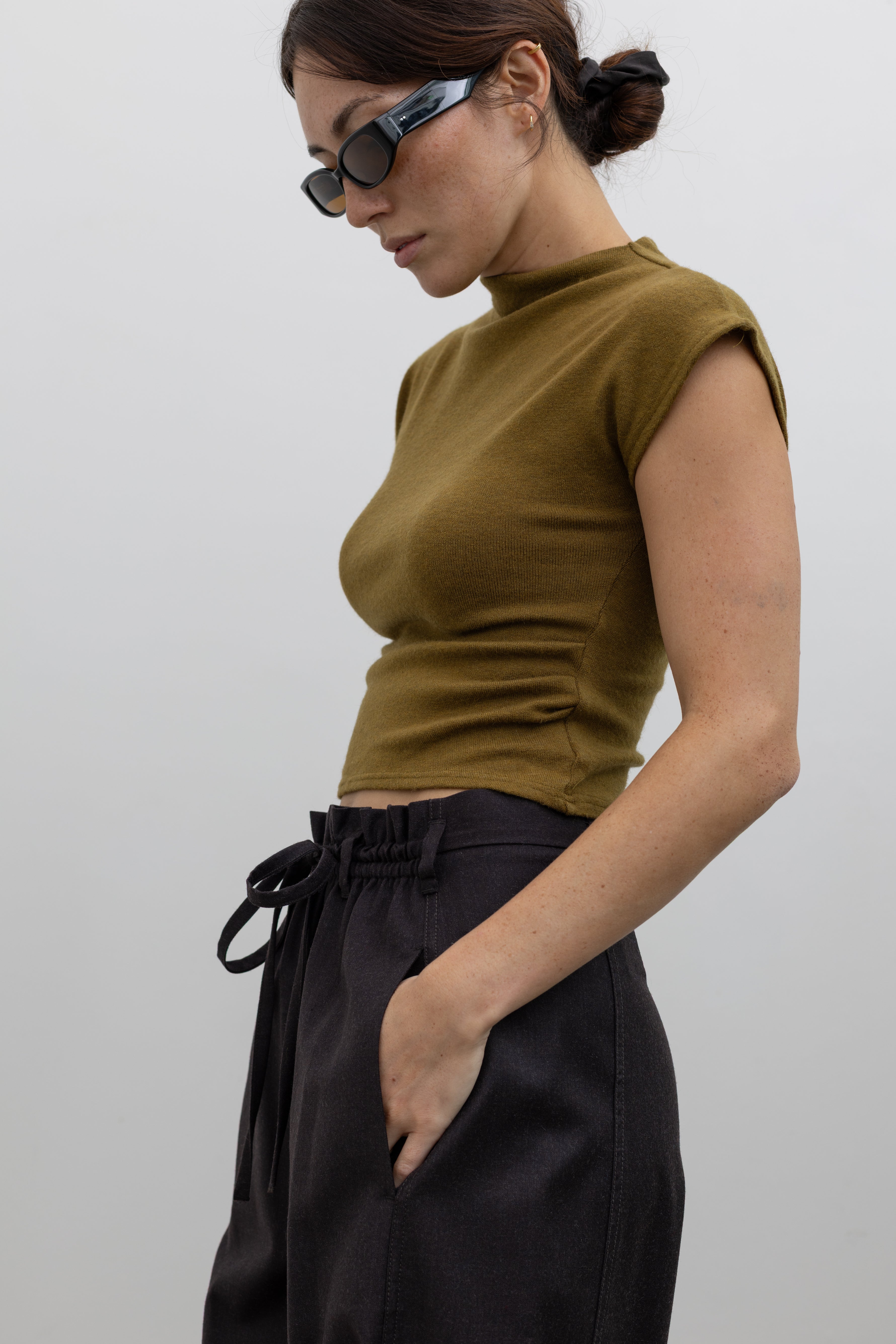 Tela Lucio Italian-made wool-blend trousers featuring a fluid wide-leg silhouette and comfortable drawstring waist at alas eius.