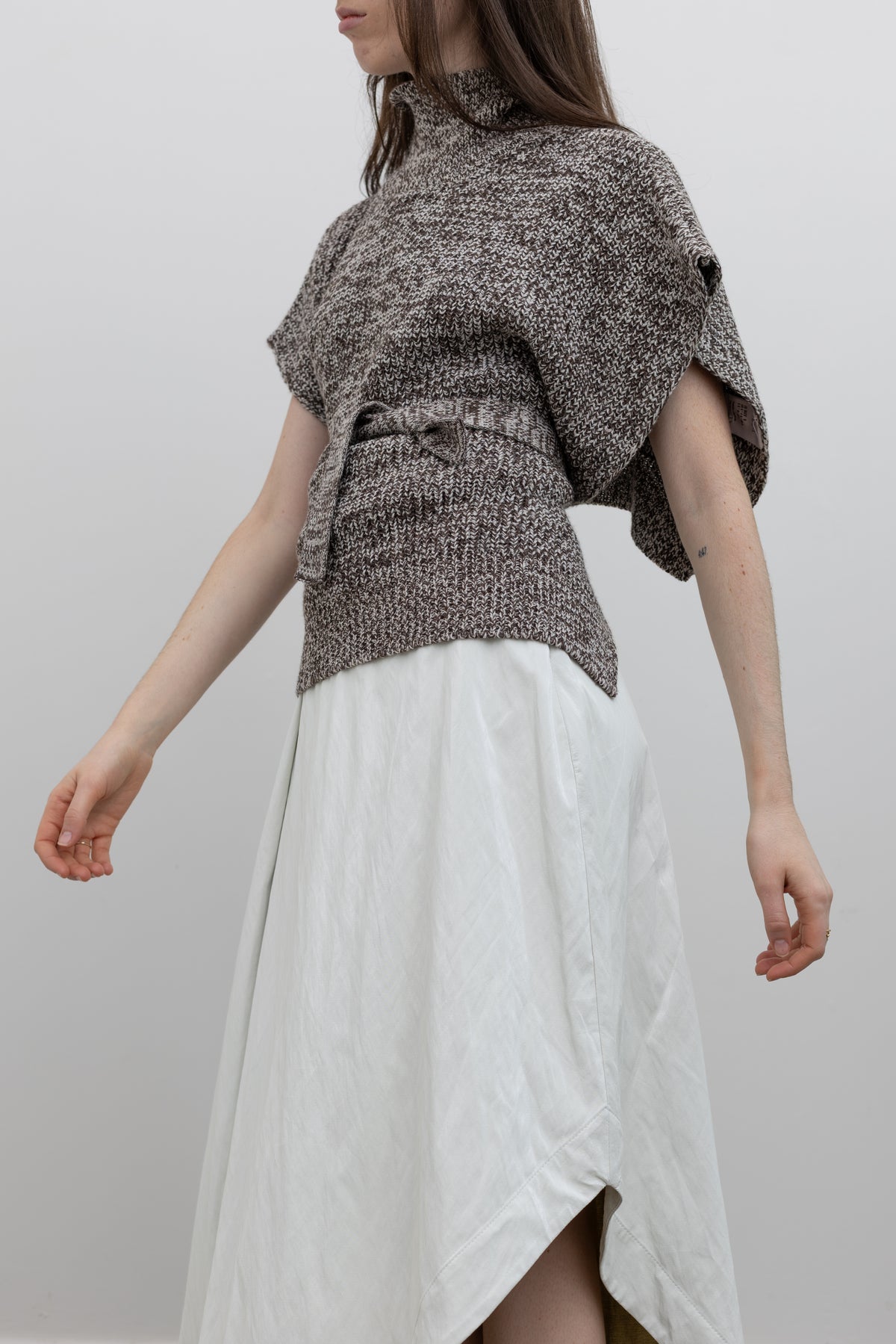 Tela Mélange Wool Blend Sleeveless Sweater with High Neck at Alas Eius