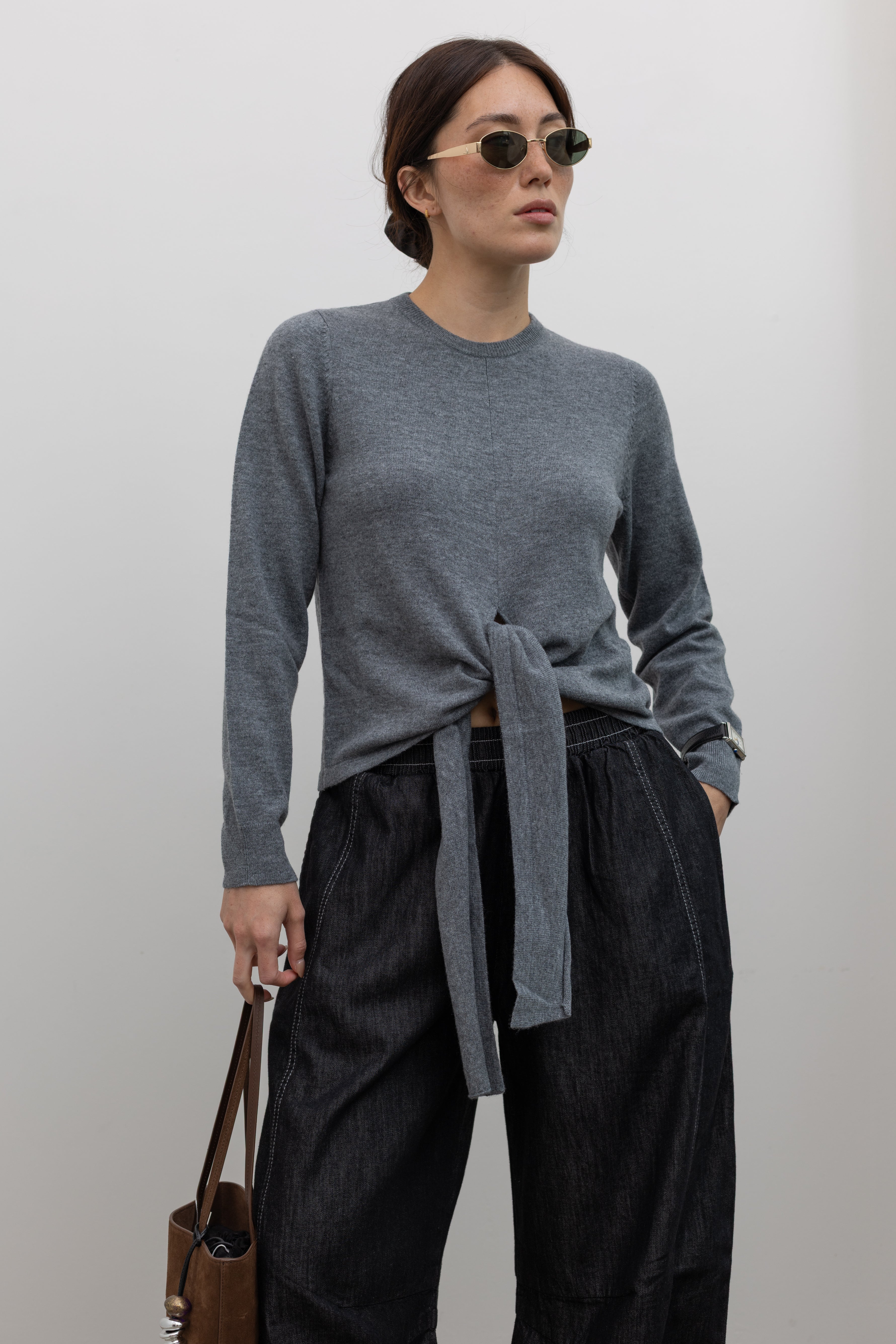 TELA minimalist grey melange sweater with feminine silhouette at Alas Eius