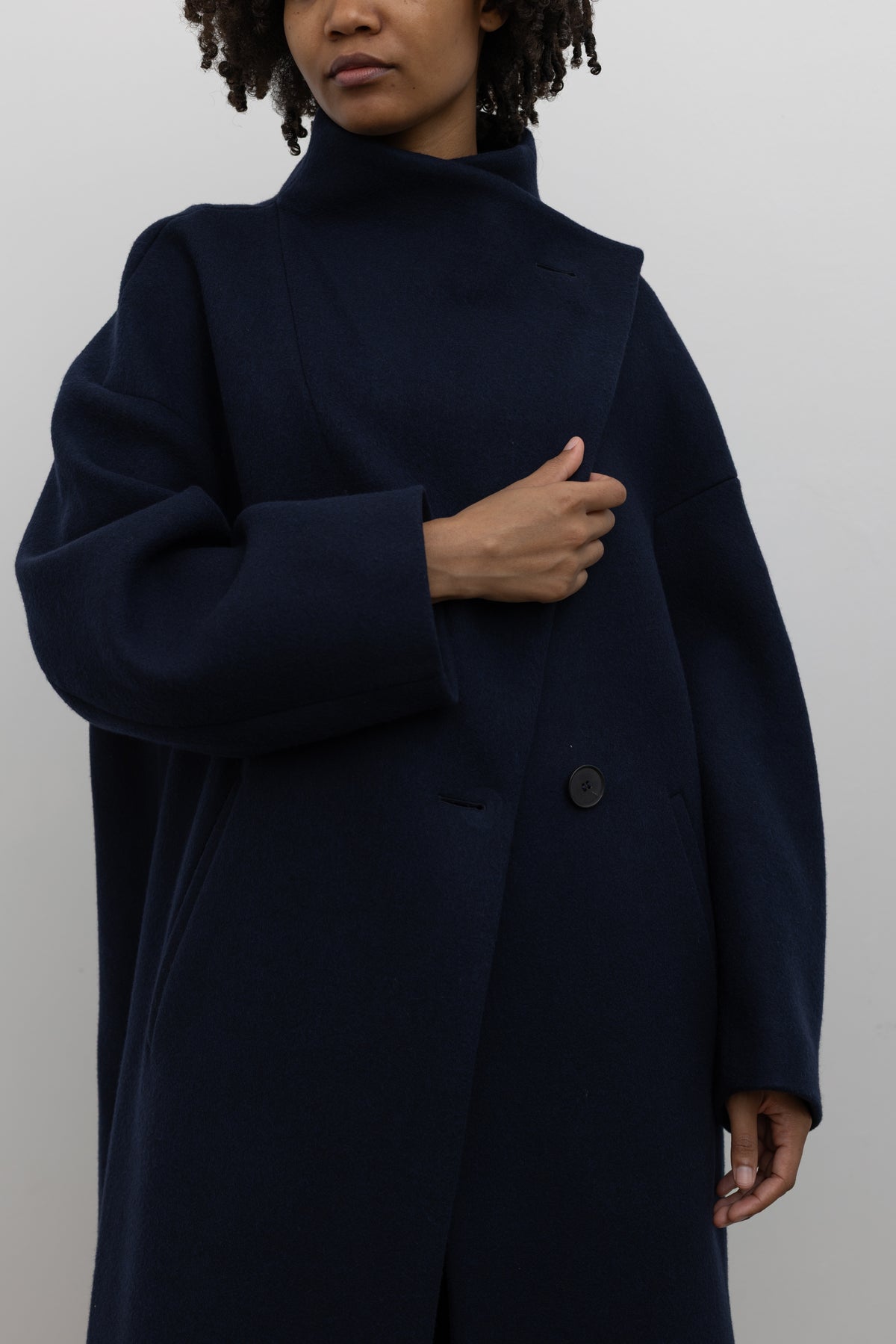 Tela Scott midnight blue sculptural coat modern womenswear at Alas Eius