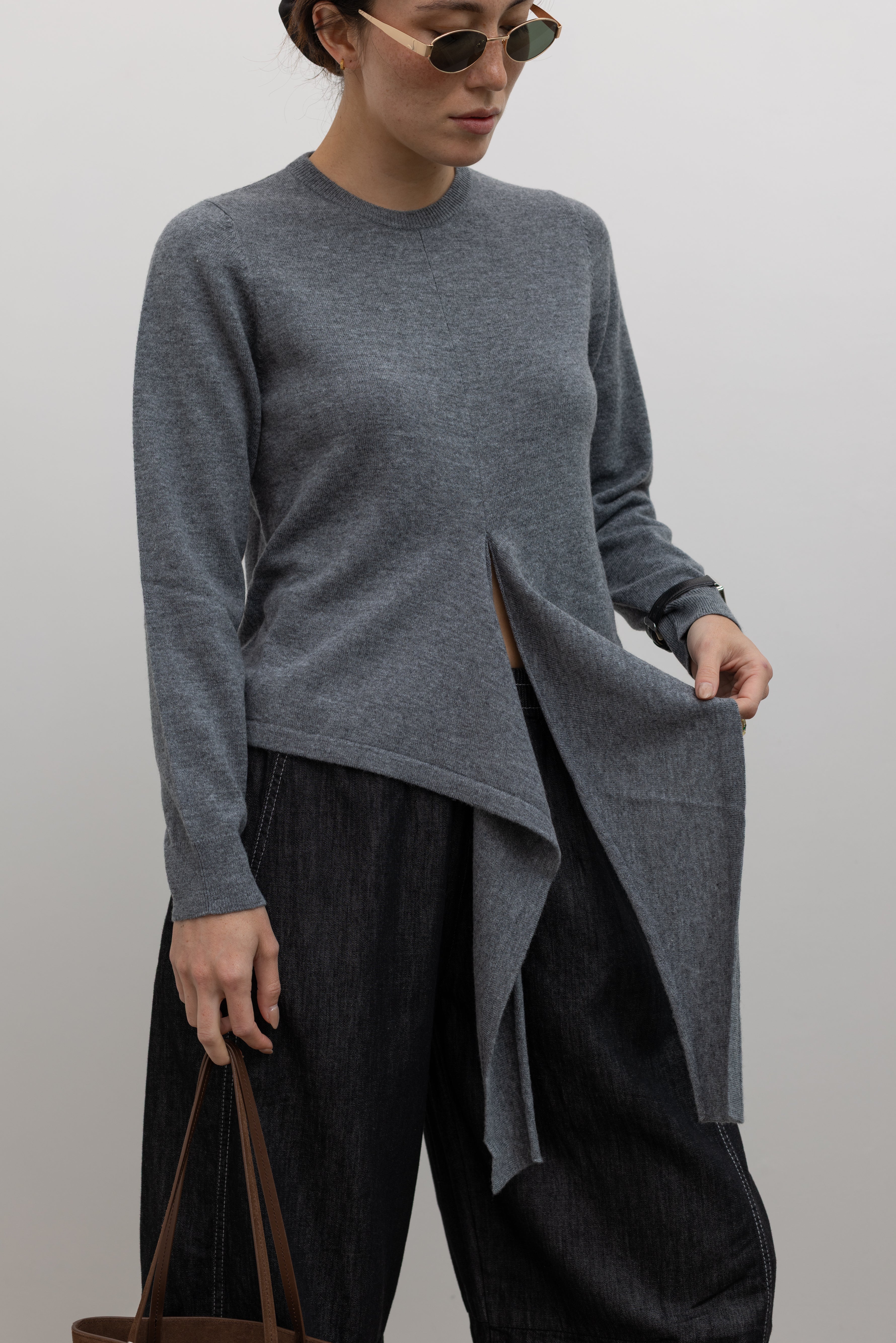 TELA soft wool knit top featuring gathered waist detail and slim fit at Alas Eius
