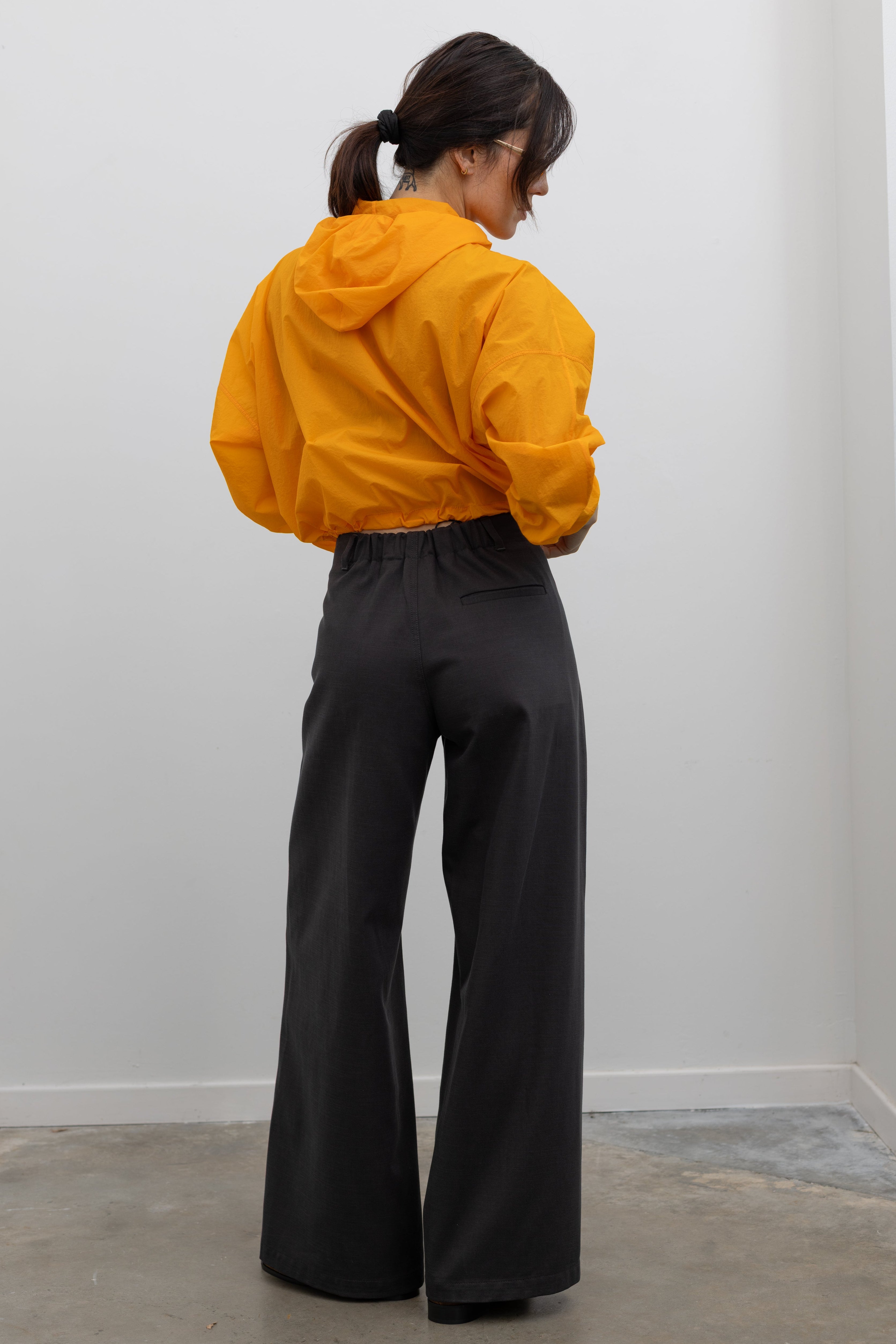 Tela Vanda dark grey cotton trousers styled with knitwear at Alas Eius