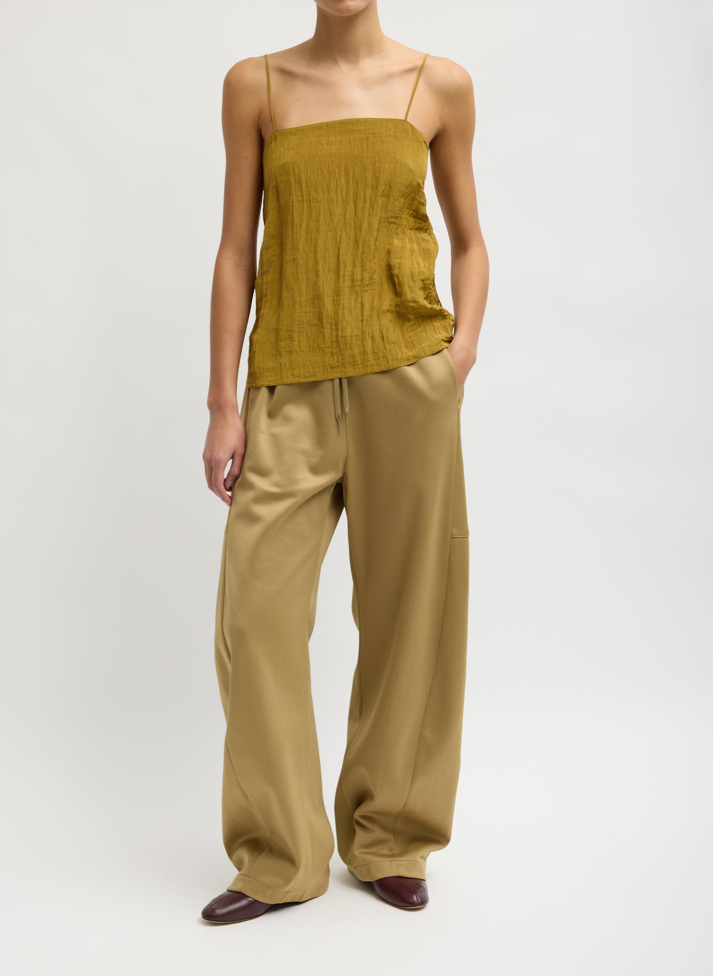Tibi Active Knit Winslow Pant with wide leg silhouette and adjustable snap hem, luxury contemporary women's trousers at Alas Eius
