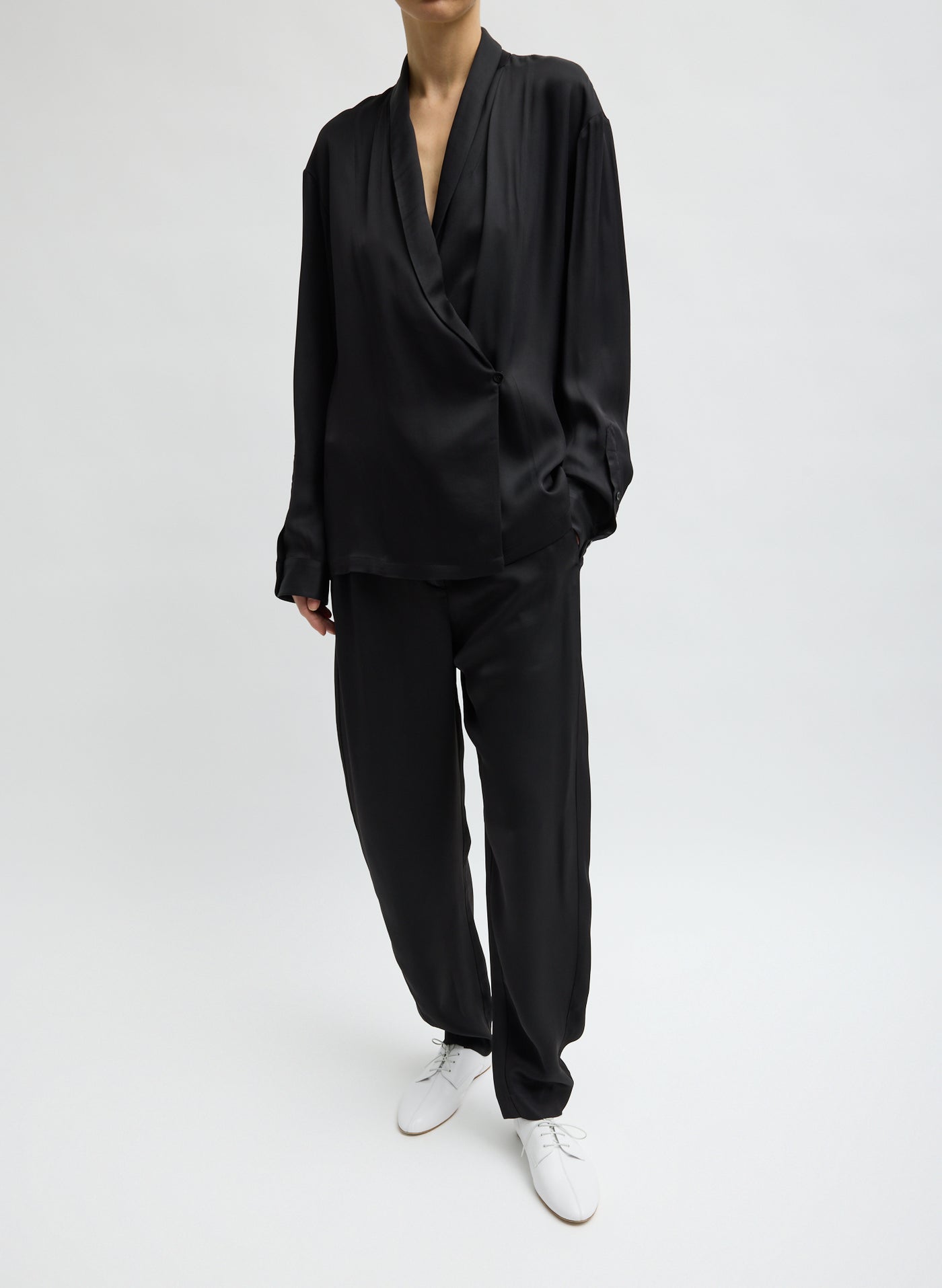 Tibi curved-leg tailored trousers with modern silhouette at Alas Eius