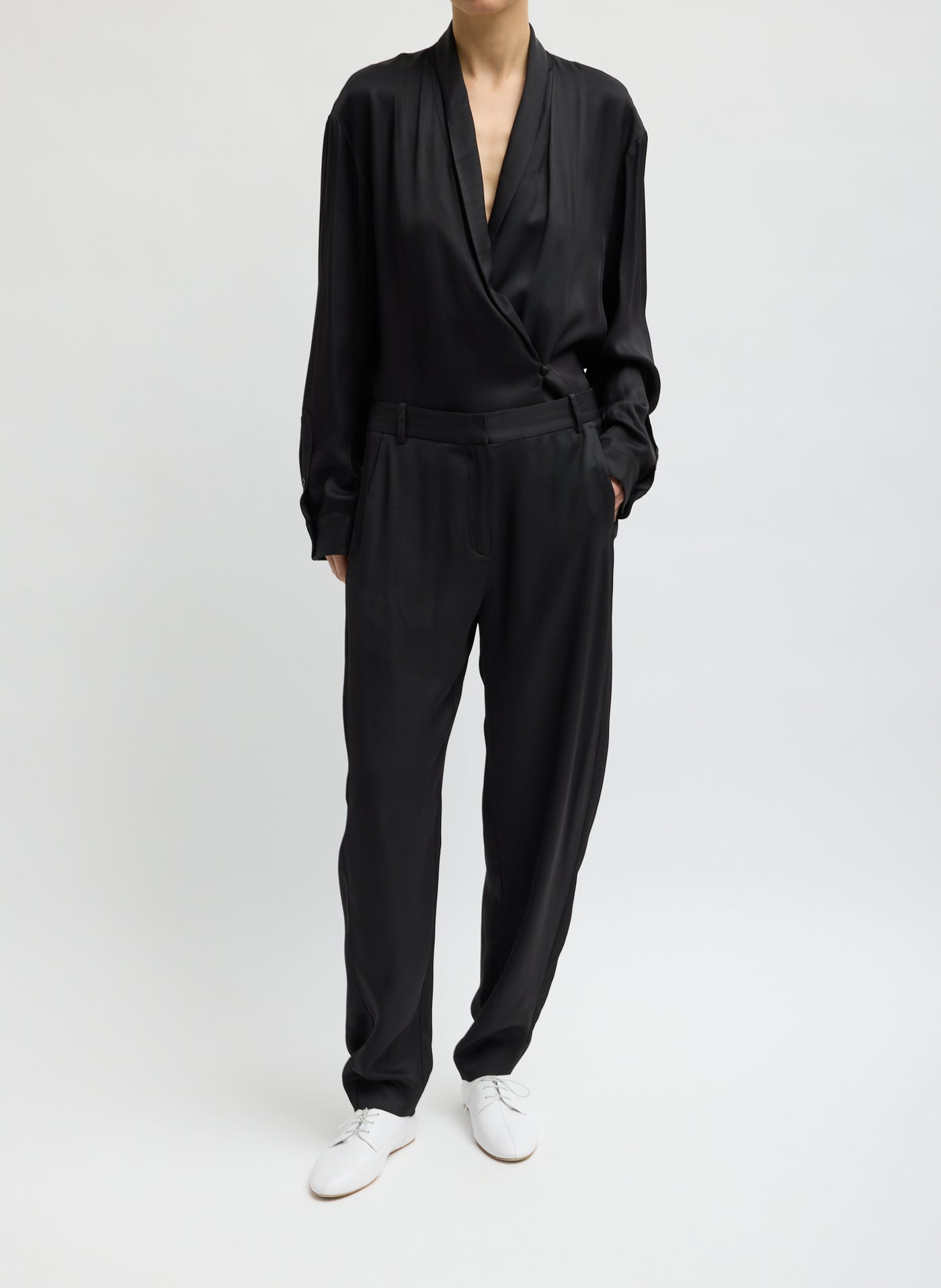 Tibi eco-conscious viscose blend curved-leg trousers with relaxed fit at Alas Eius