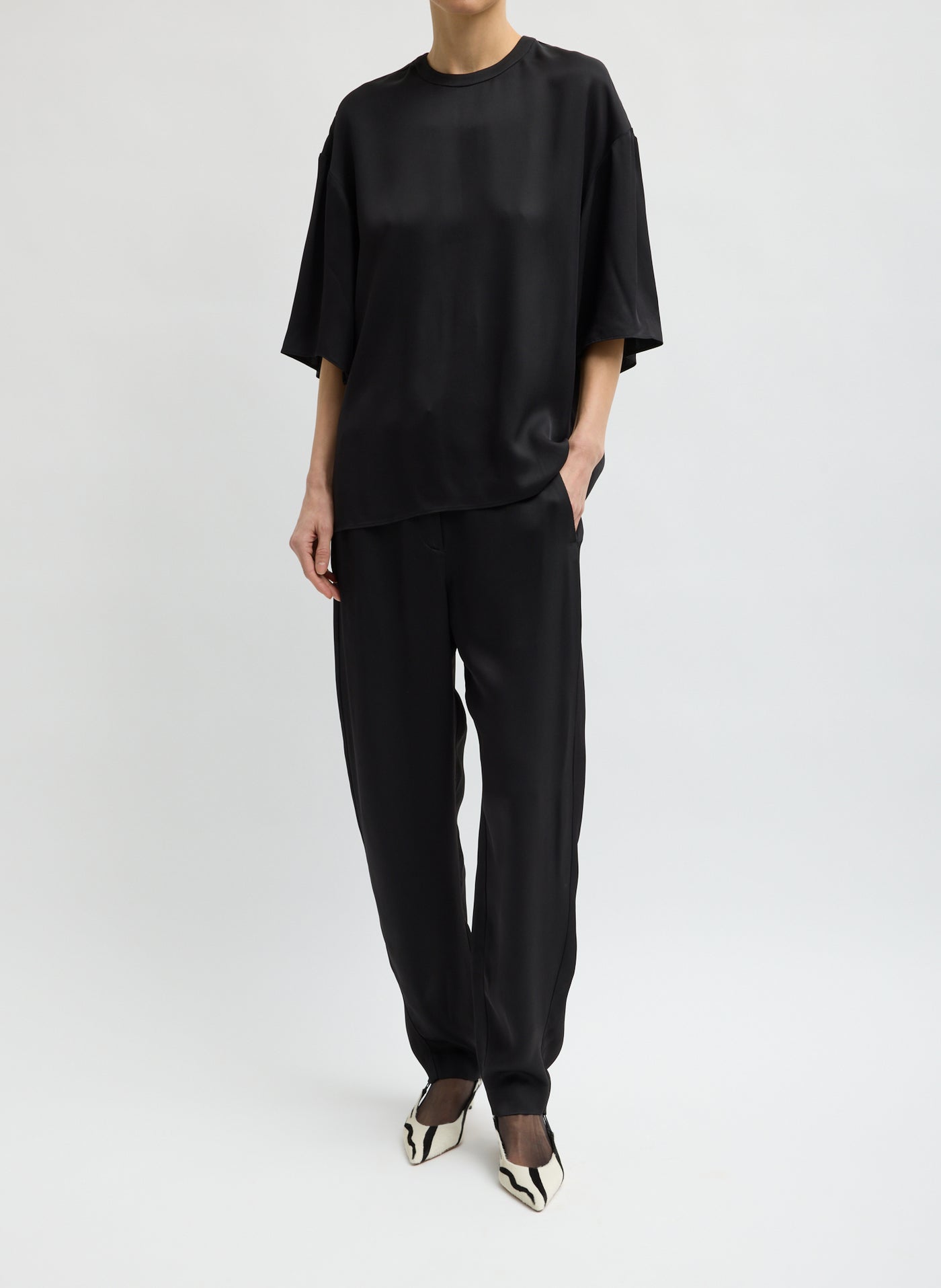 Tibi elevated wide-leg trousers with fluid movement at Alas Eius
