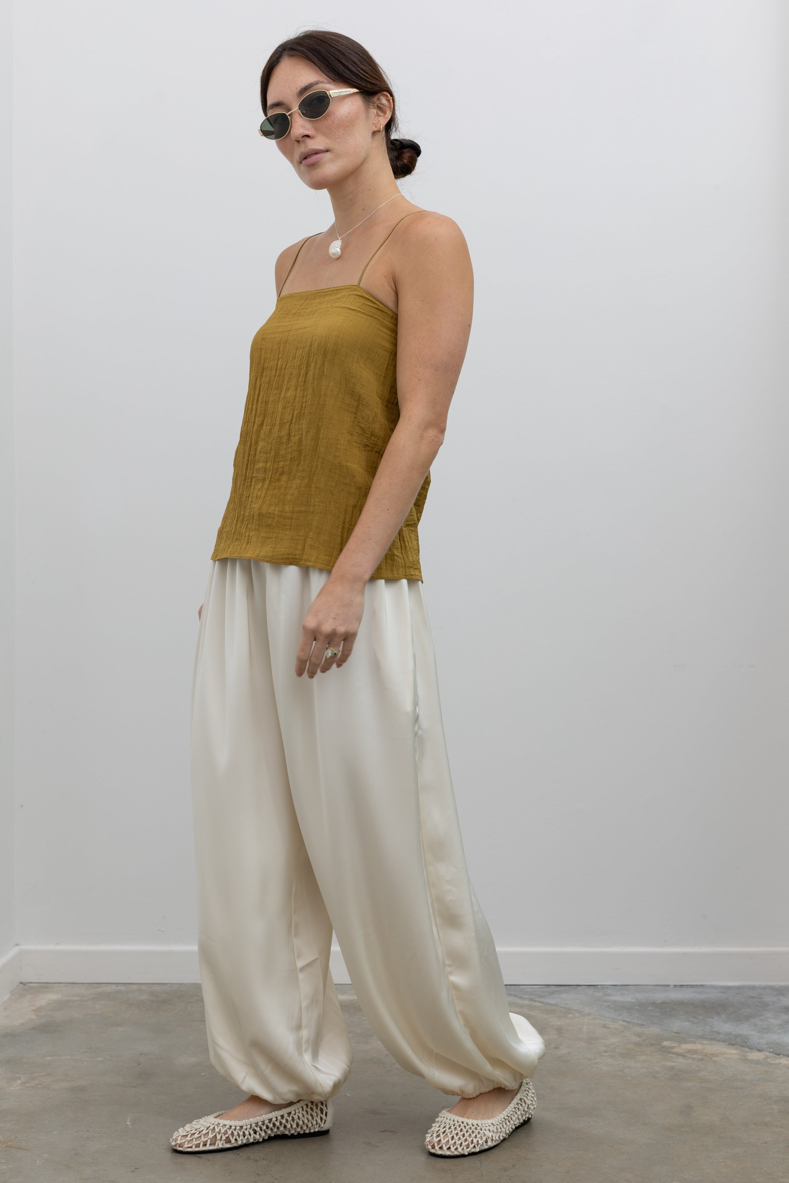 Tibi versatile crinkle camisole with fluid drape and effortless layering style at Alas Eius