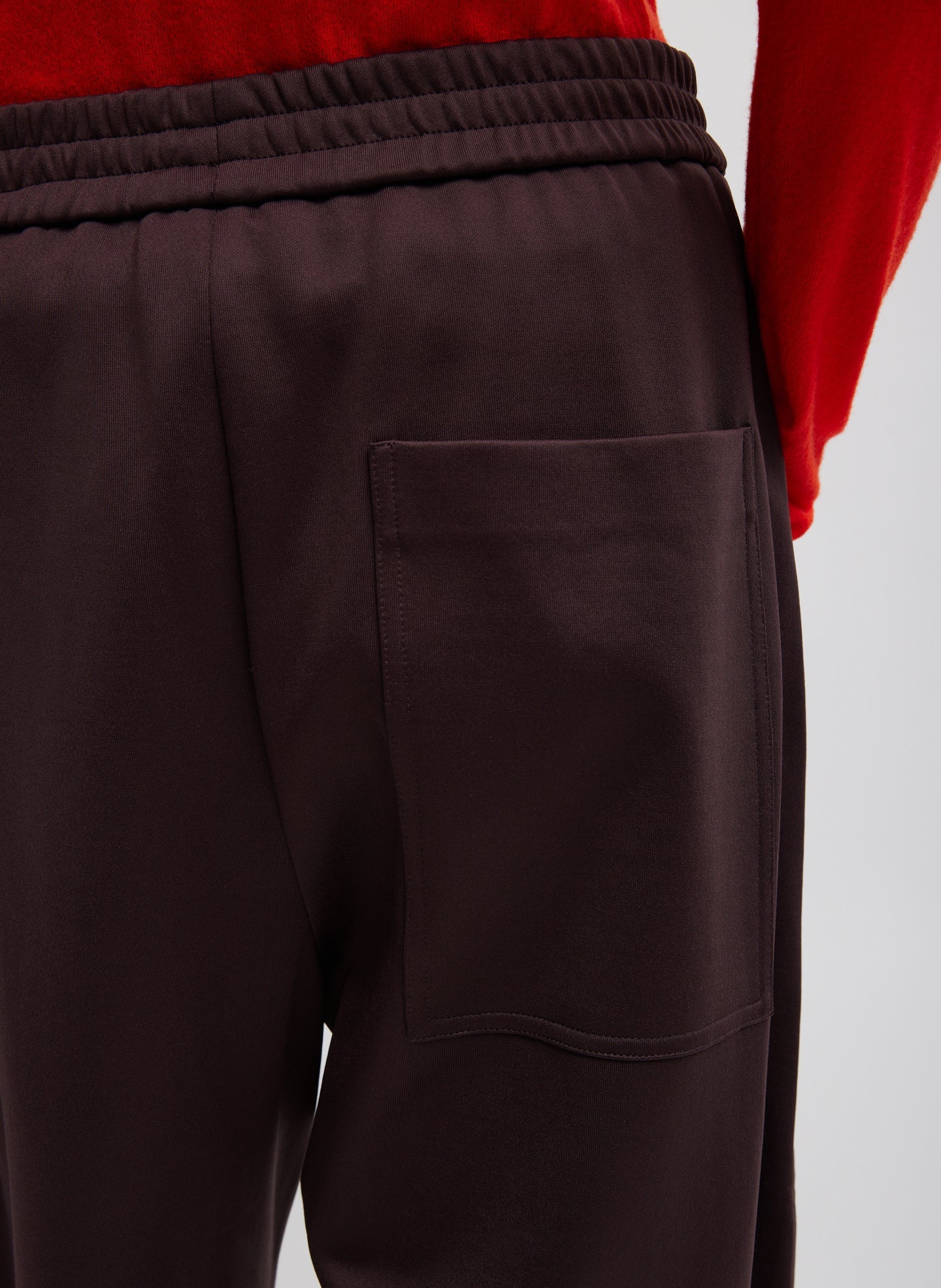 Tibi Active Knit Winslow Pant with innovative snap hem and relaxed tailoring, modern luxury womenswear at Alas Eius